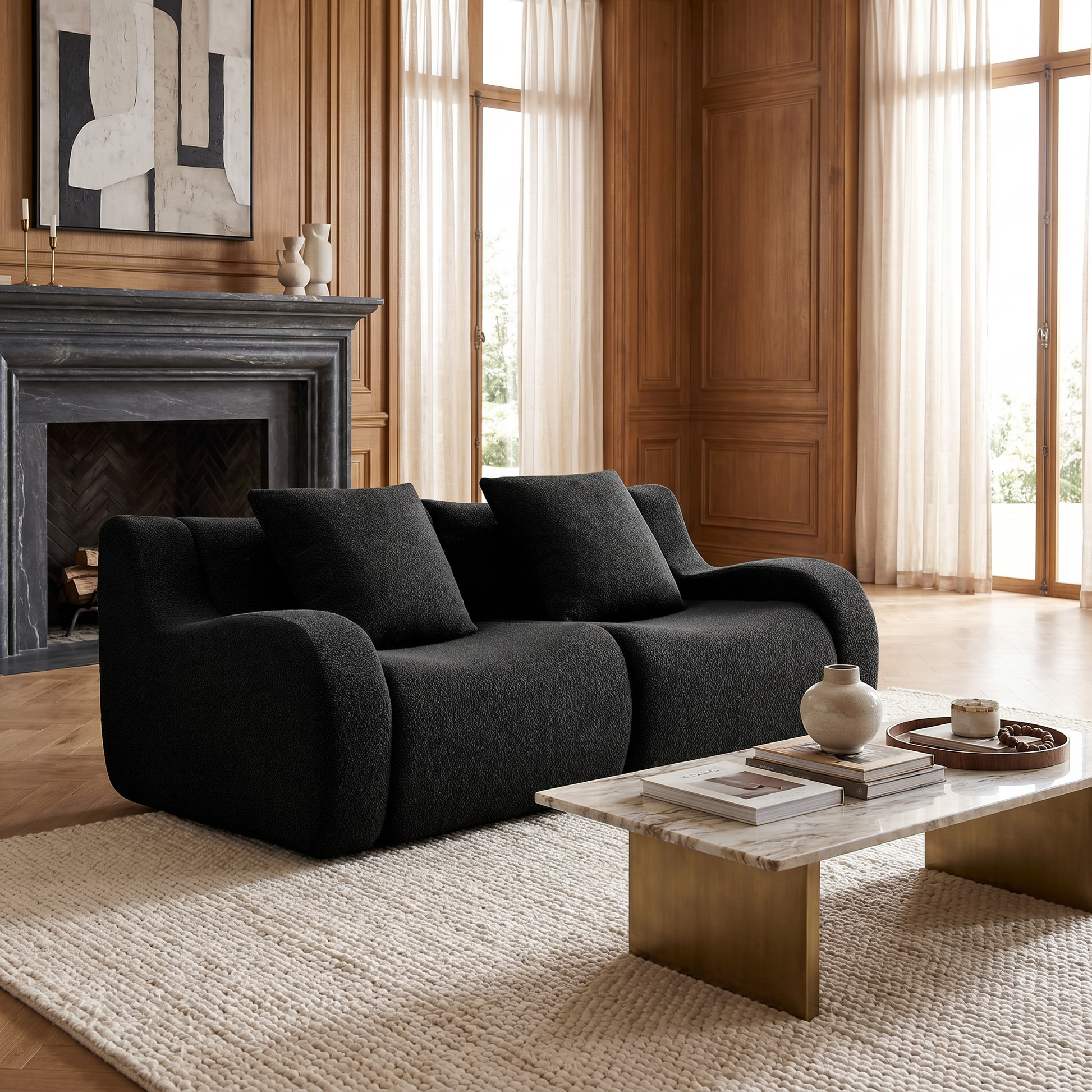 Chico black loveseat sofa showing cozy lounge setup near a fireplace