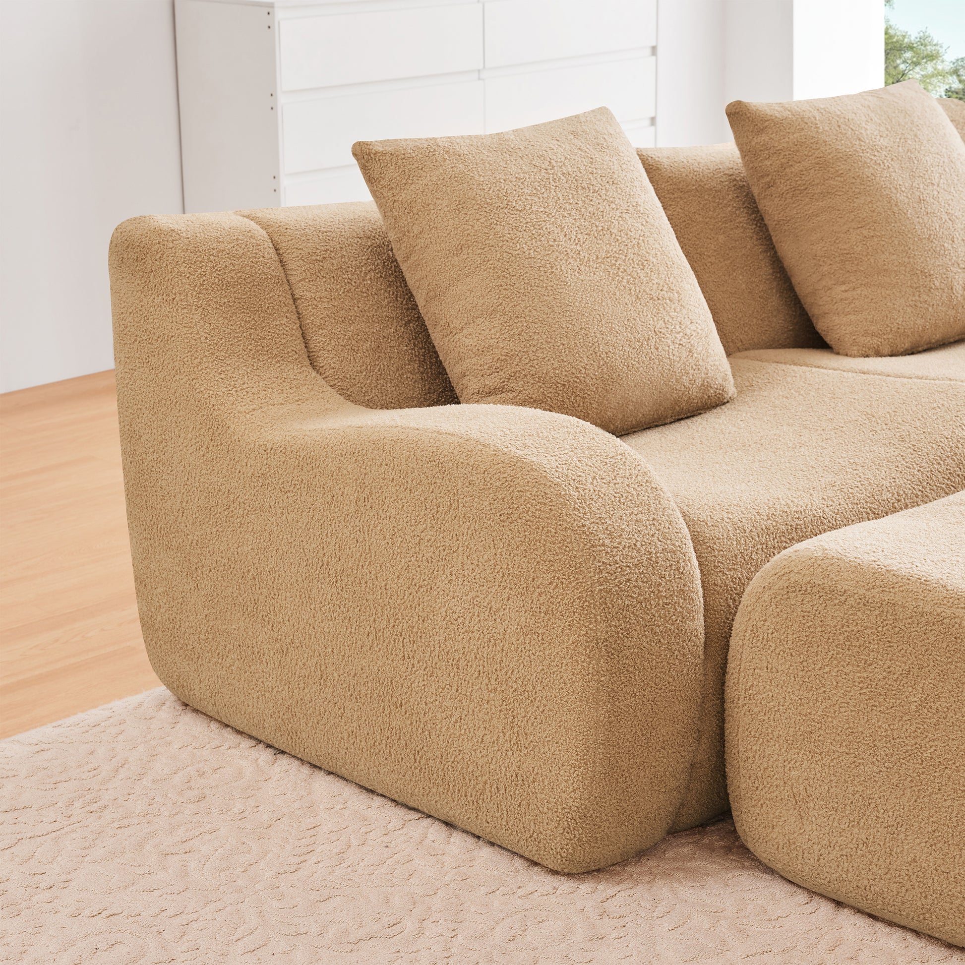 Chico light camel loveseat sofa showing seat armrest and pillow detail