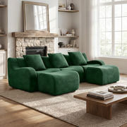 Chico green U-shaped sectional sofa in cozy living room with stone fireplace and wood coffee table