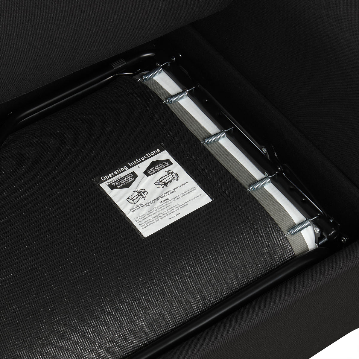 Chula black loveseat sleeper sofa showing pull-out sleeper mechanism detail