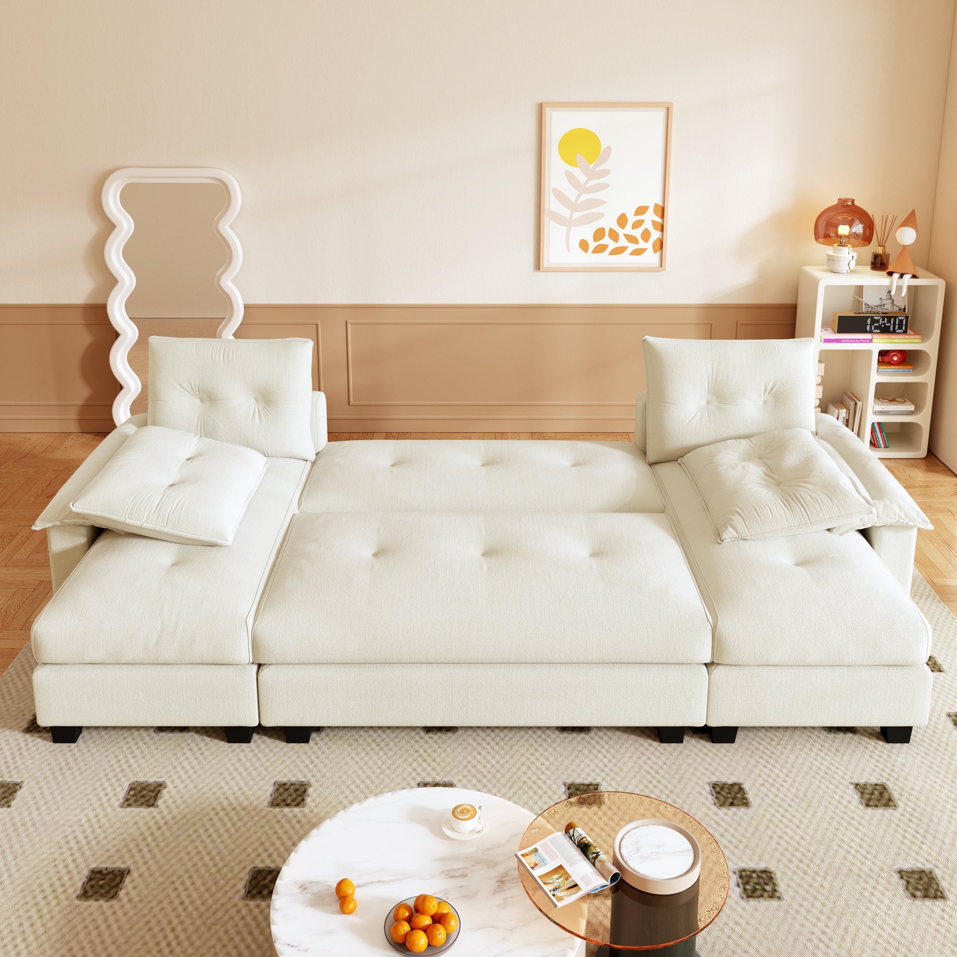 Clovis beige sleeper sofa bed showing fully extended flat bed layout in lifestyle setting