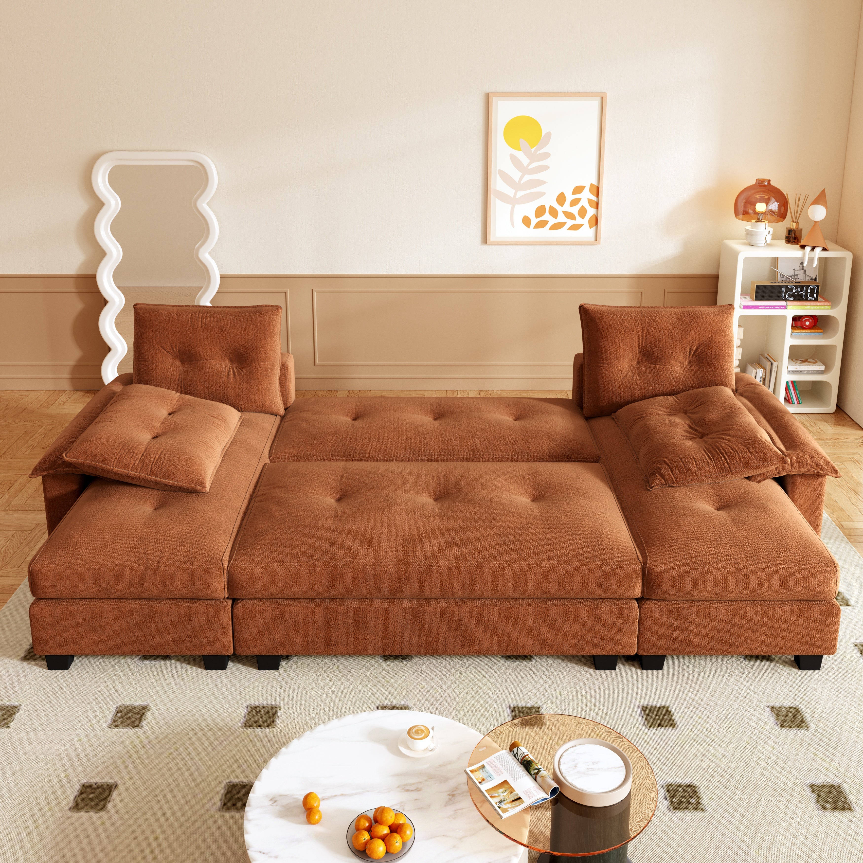 Clovis orange sleeper sofa bed showing extended bed layout in cozy lifestyle setting