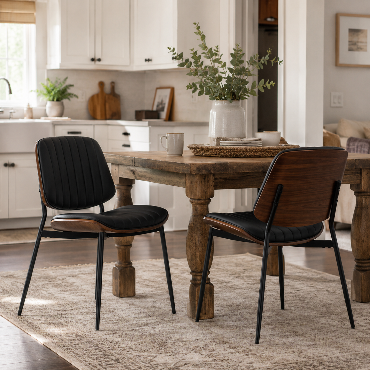 Colorado black dining chairs with wood backs beside a wood dining table in a cozy dining space