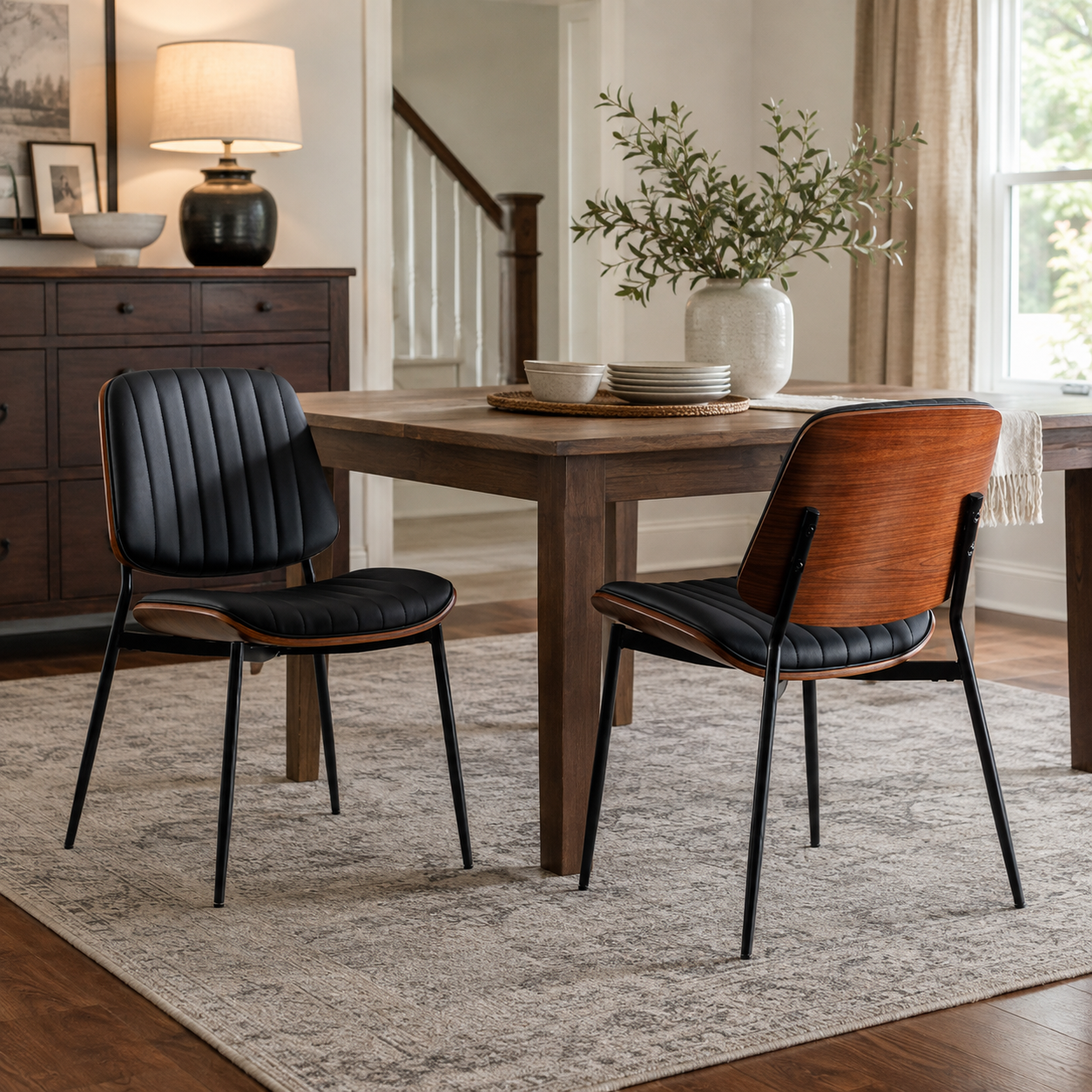 Colorado black PU leather dining chair set with metal legs in a bright modern dining area