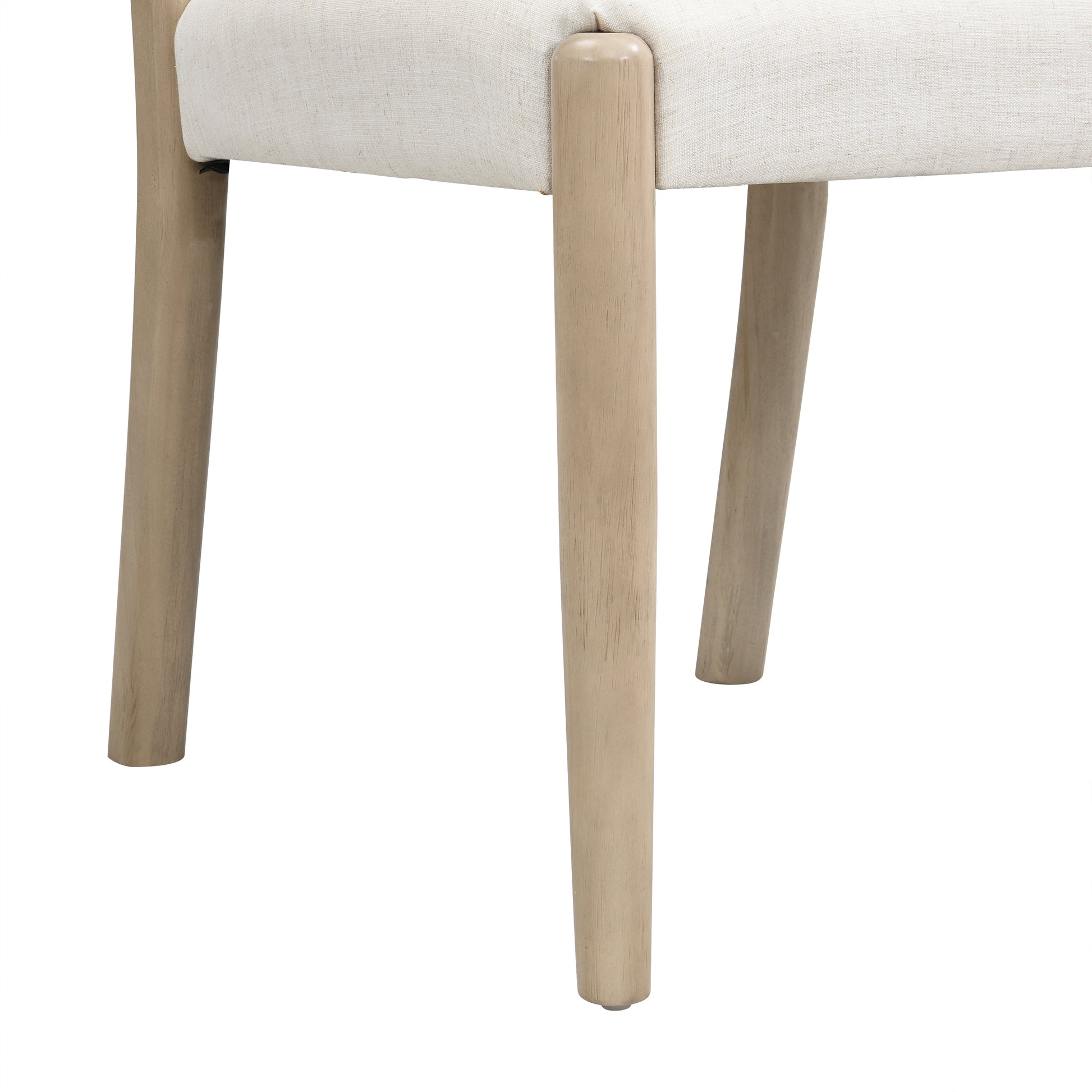 Constance natural dining chair close-up of the tapered rubberwood leg and upholstered seat