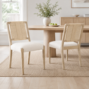 Constance natural woven rope dining chairs with upholstered seats beside a light wood dining table
