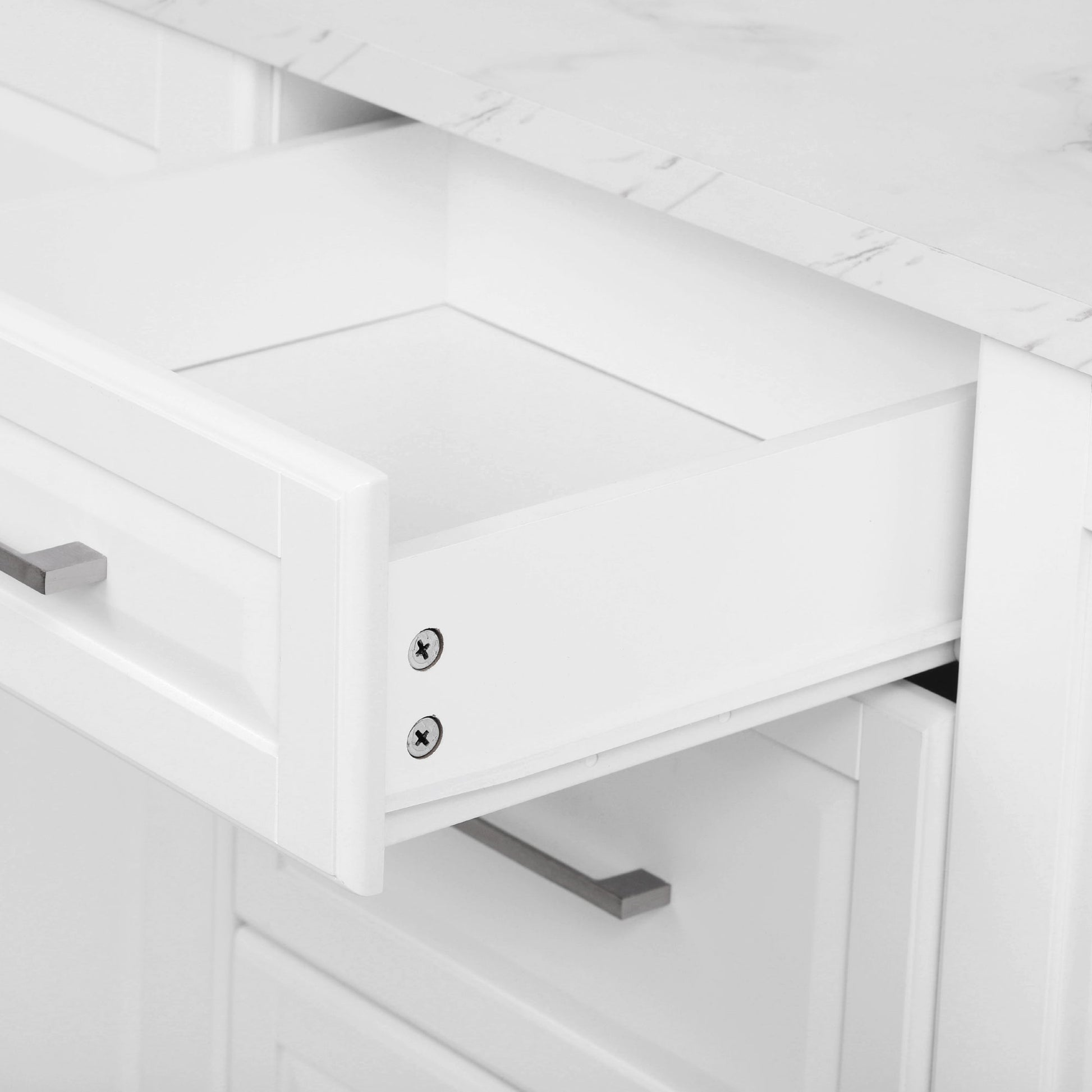 Deauville gray kitchen island showing spacious utility drawer with smooth-glide storage for kitchen tools and accessories