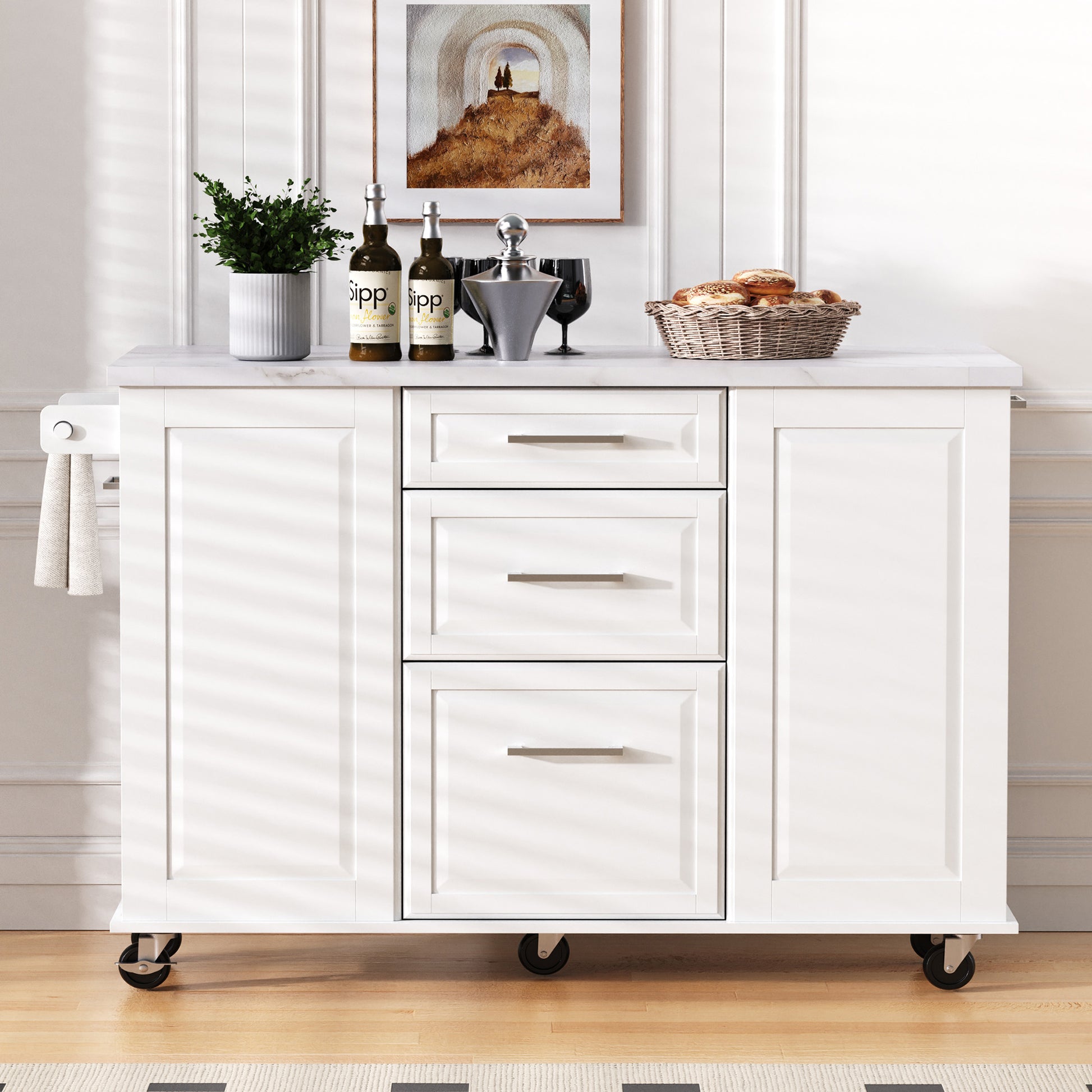Deauville white kitchen island showing drop leaf countertop drawers storage cabinets towel bar and rolling caster wheels