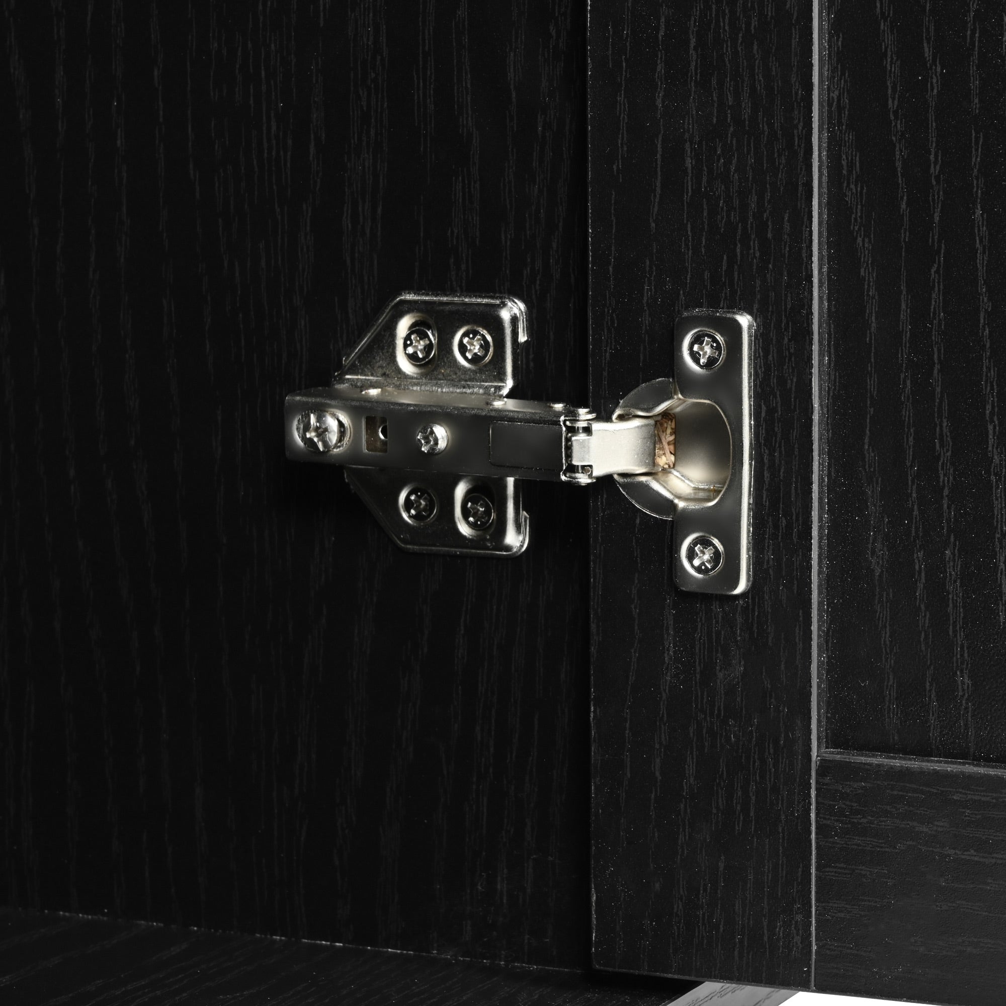 Close-up detail of cabinet door hinge and black wood grain finish on Dijon farmhouse rolling kitchen island isolated on white background
