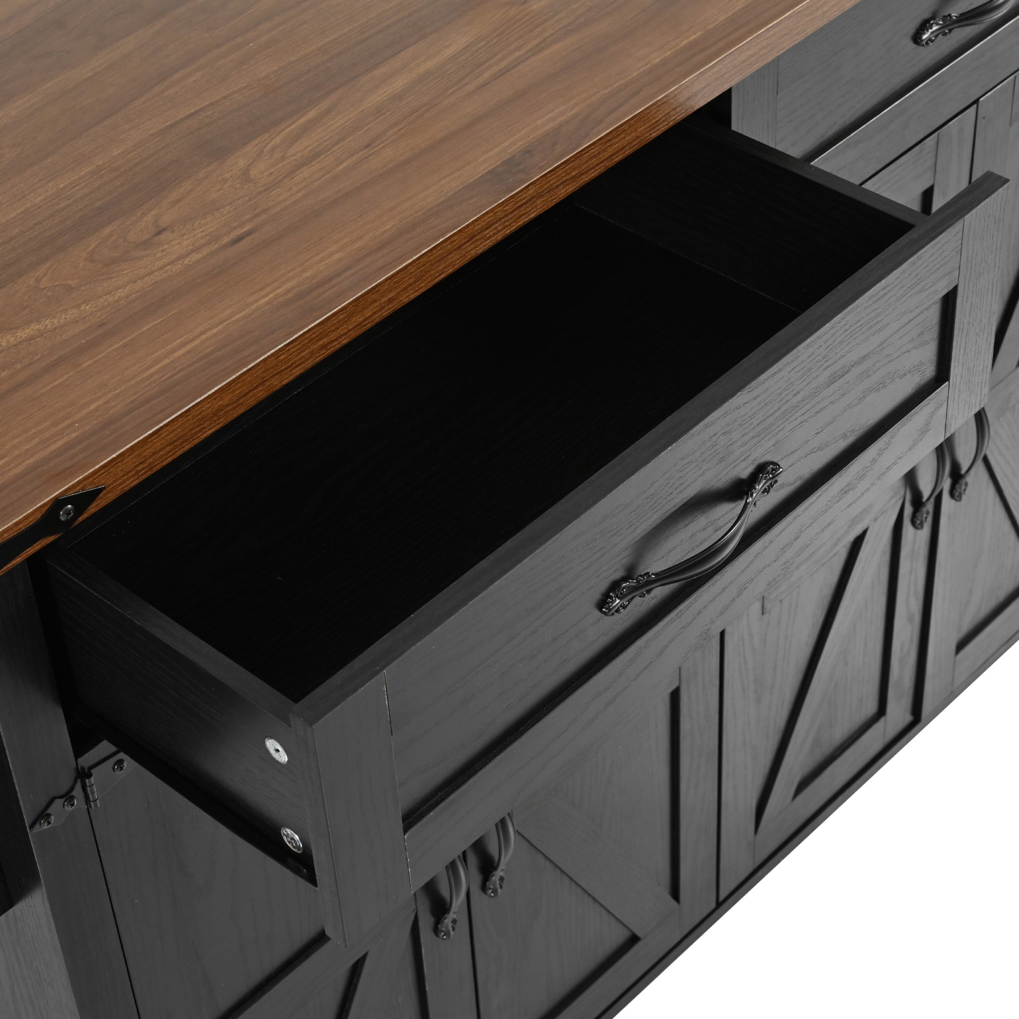 Close-up of open storage drawer on black Dijon farmhouse rolling kitchen island with wood grain countertop and cabinet detail isolated on white background