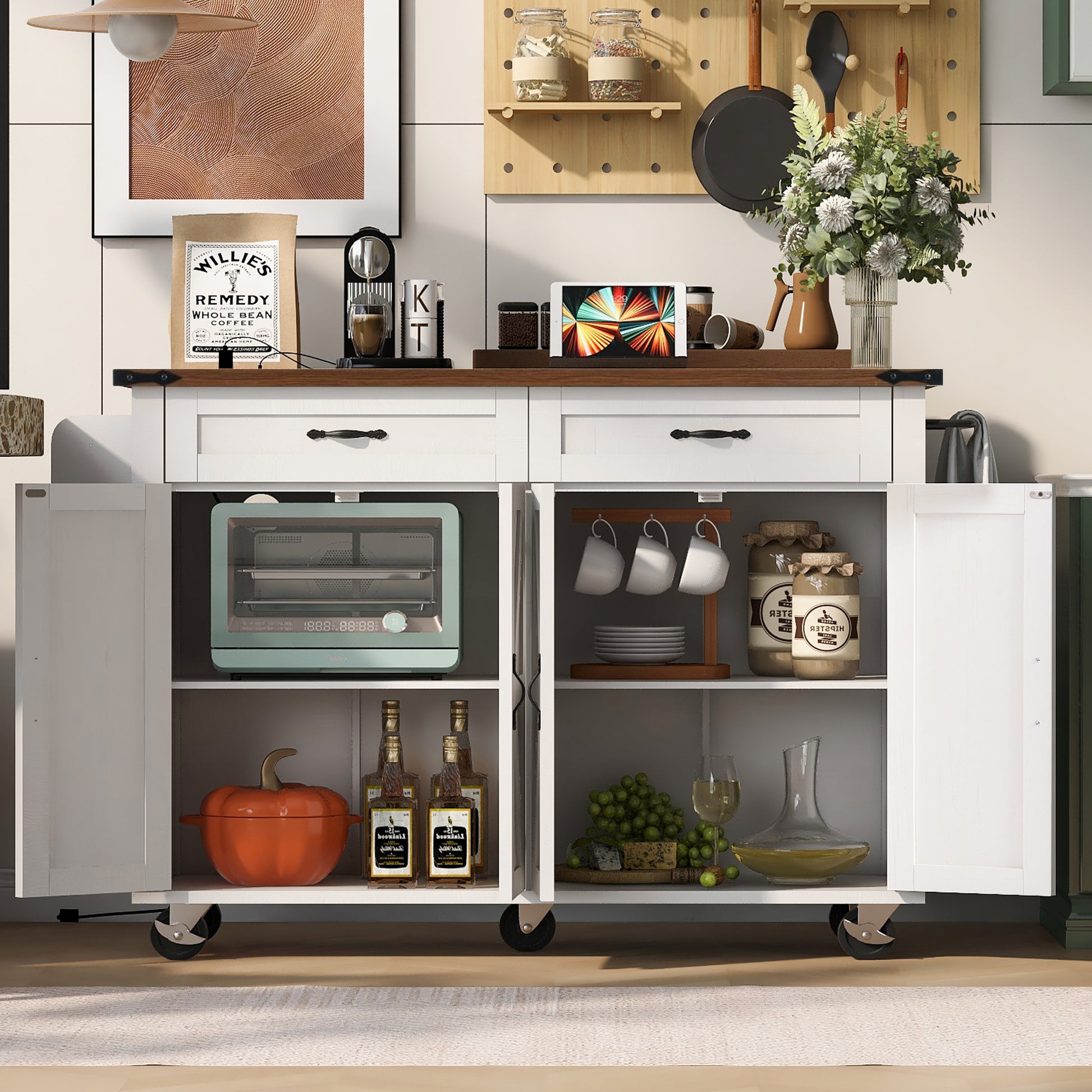 White Dijon farmhouse rolling kitchen island with open cabinet storage drawers side towel rack and caster wheels styled in modern kitchen scene