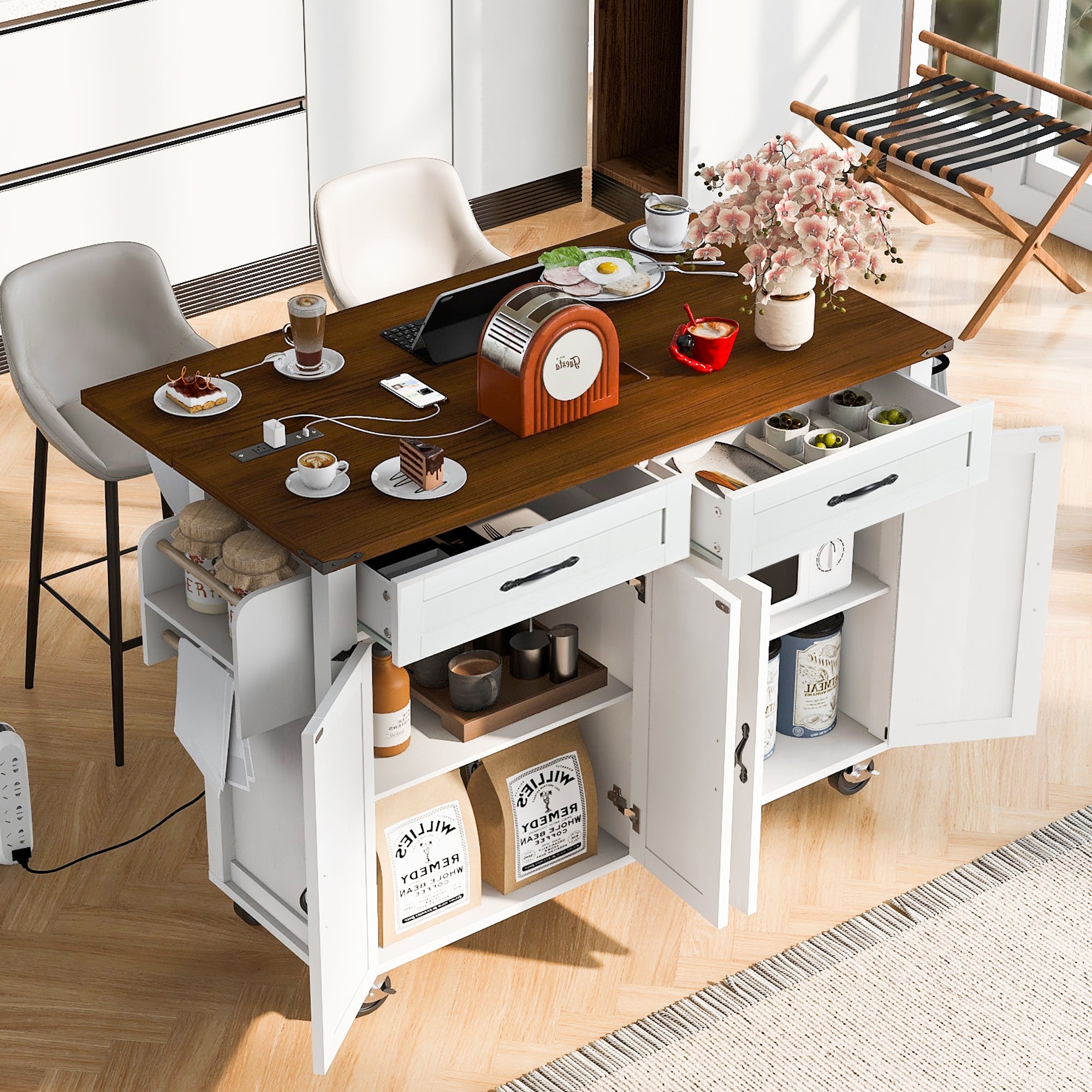 White Dijon farmhouse rolling kitchen island with open drawers cabinet storage drop leaf countertop and power outlet used as casual dining workspace in modern kitchen scene