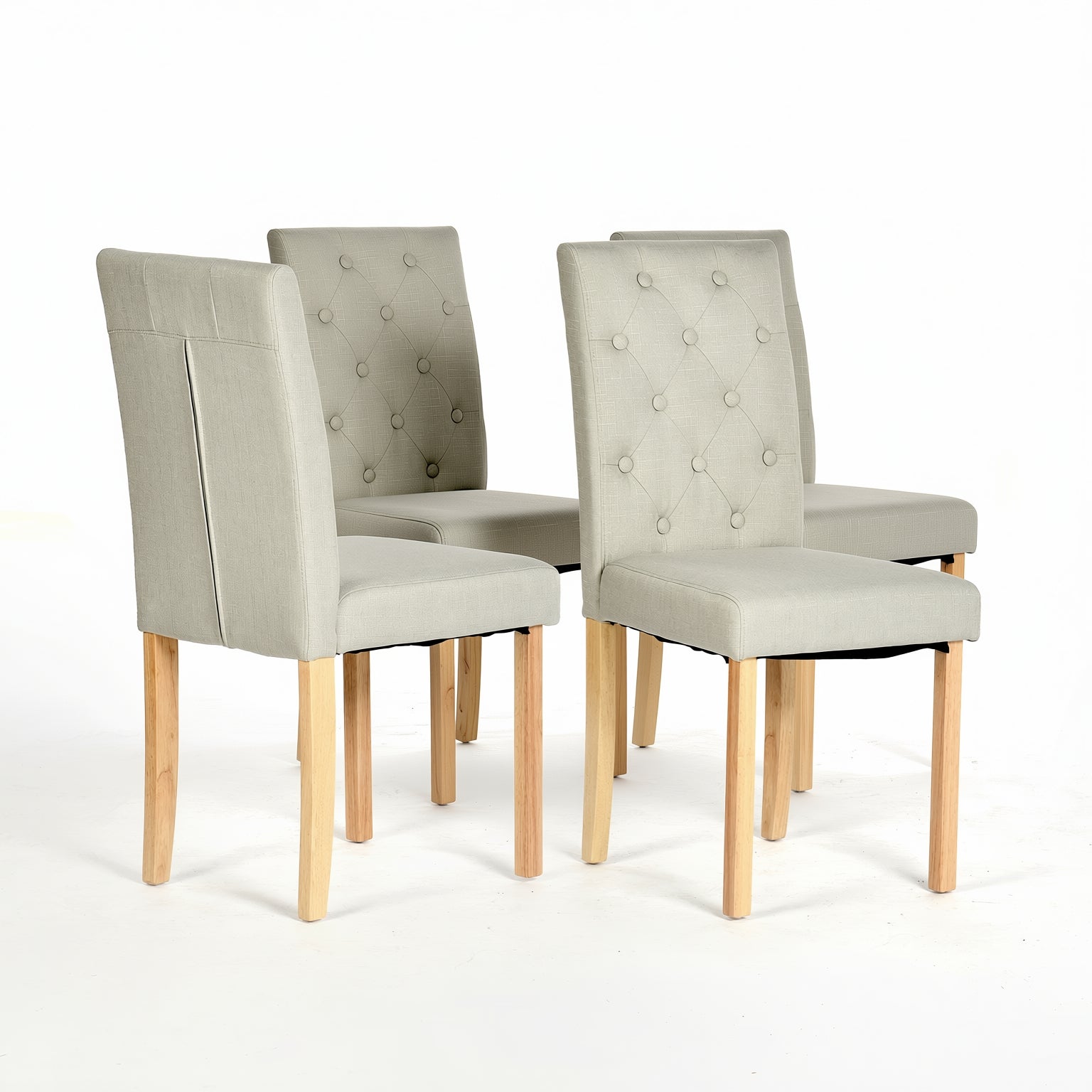 Douro light grey upholstered dining chair set of 4 with solid wood legs angled group view on white background