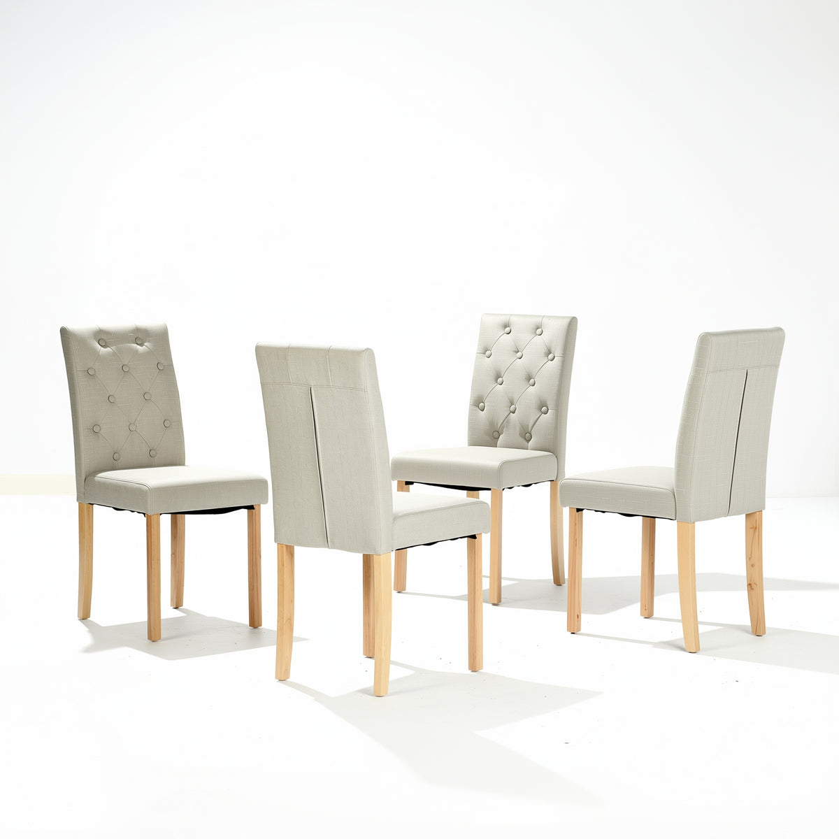 Douro light grey upholstered dining chair set of 4 with solid wood legs angled group view on white background