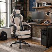 Draco gray ergonomic gaming chair with lumbar cushion and footrest in a warm home office