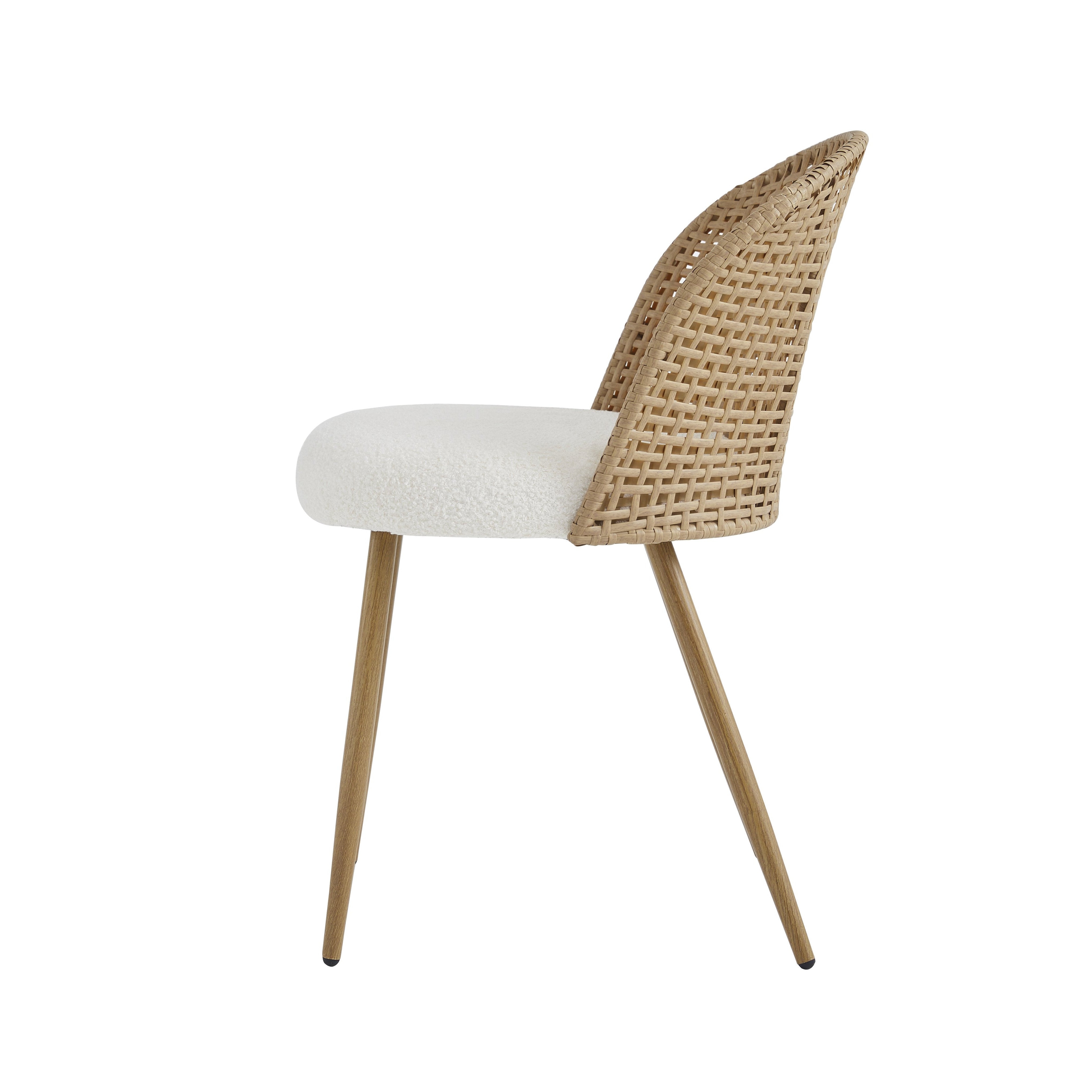 Drava beige dining chair showing the side profile with a curved rattan back and tapered metal legs
