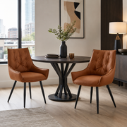 Drina brown dining chair showing two chairs beside a round dining table