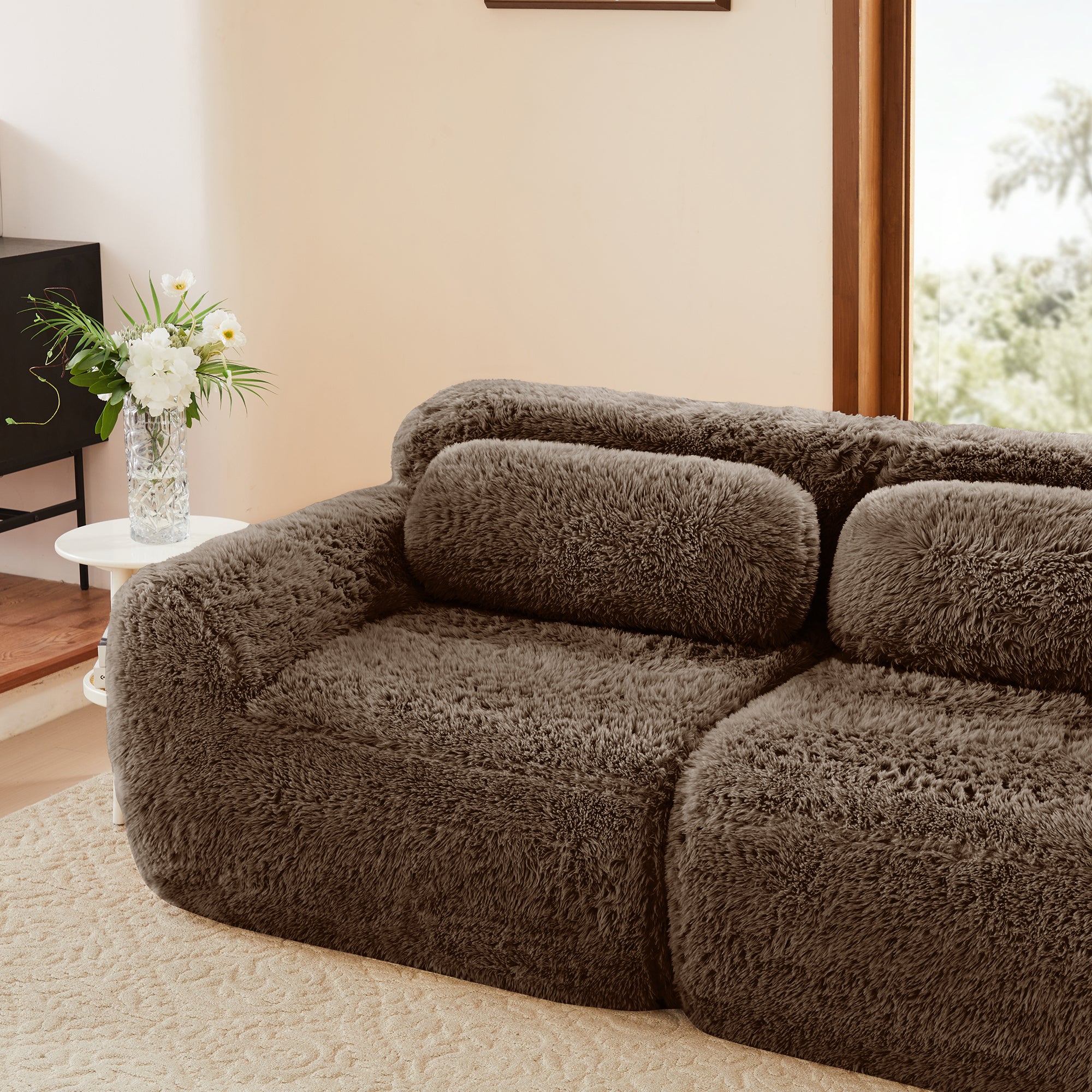 Durham brown l-shaped sectional sofa showing deep seat and curved armrest detail