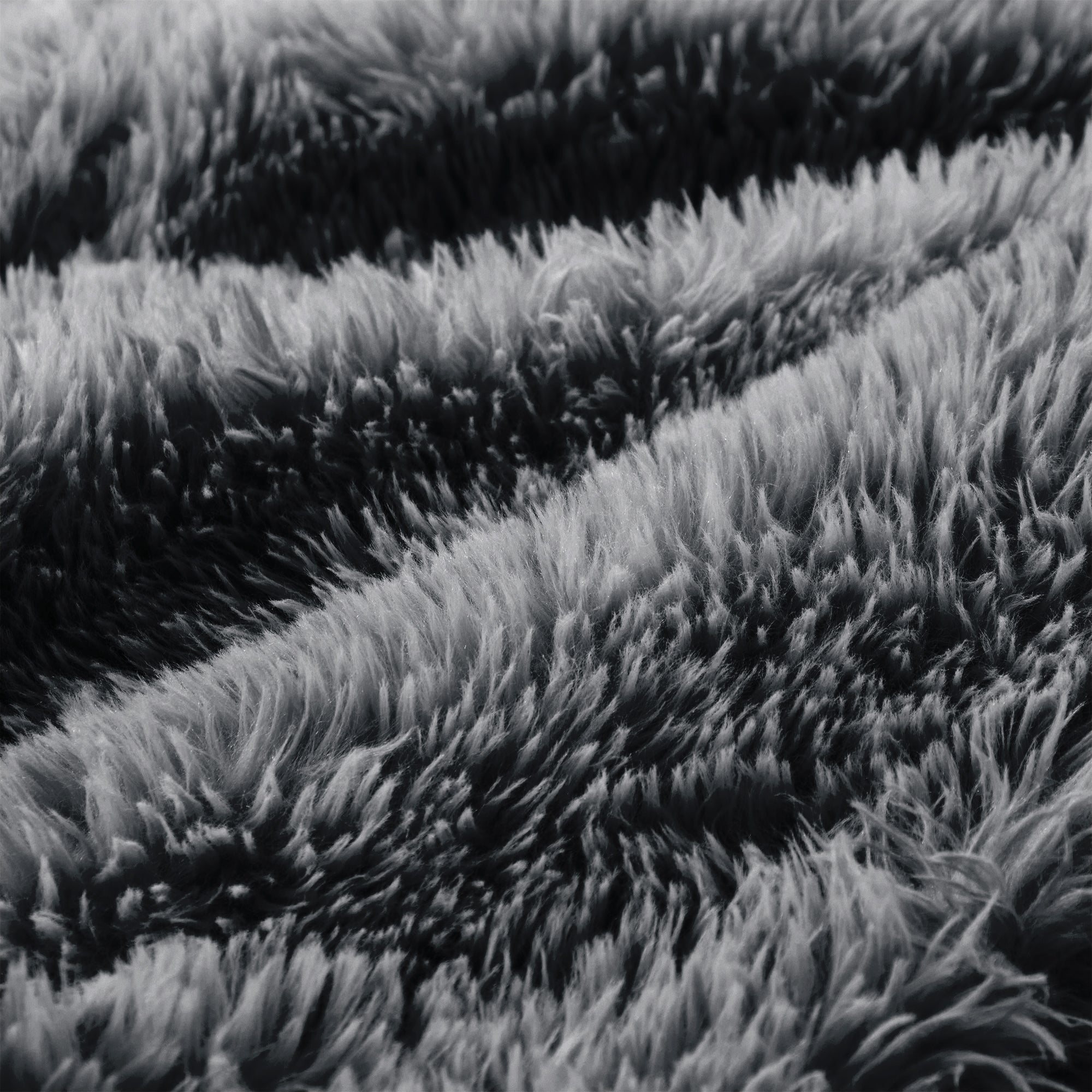 Durham grey sectional sofa showing fluffy fur texture close-up detail