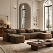 Durham brown U-shaped sectional sofa styled in a refined cream-toned living room with tall archways and layered plush seating