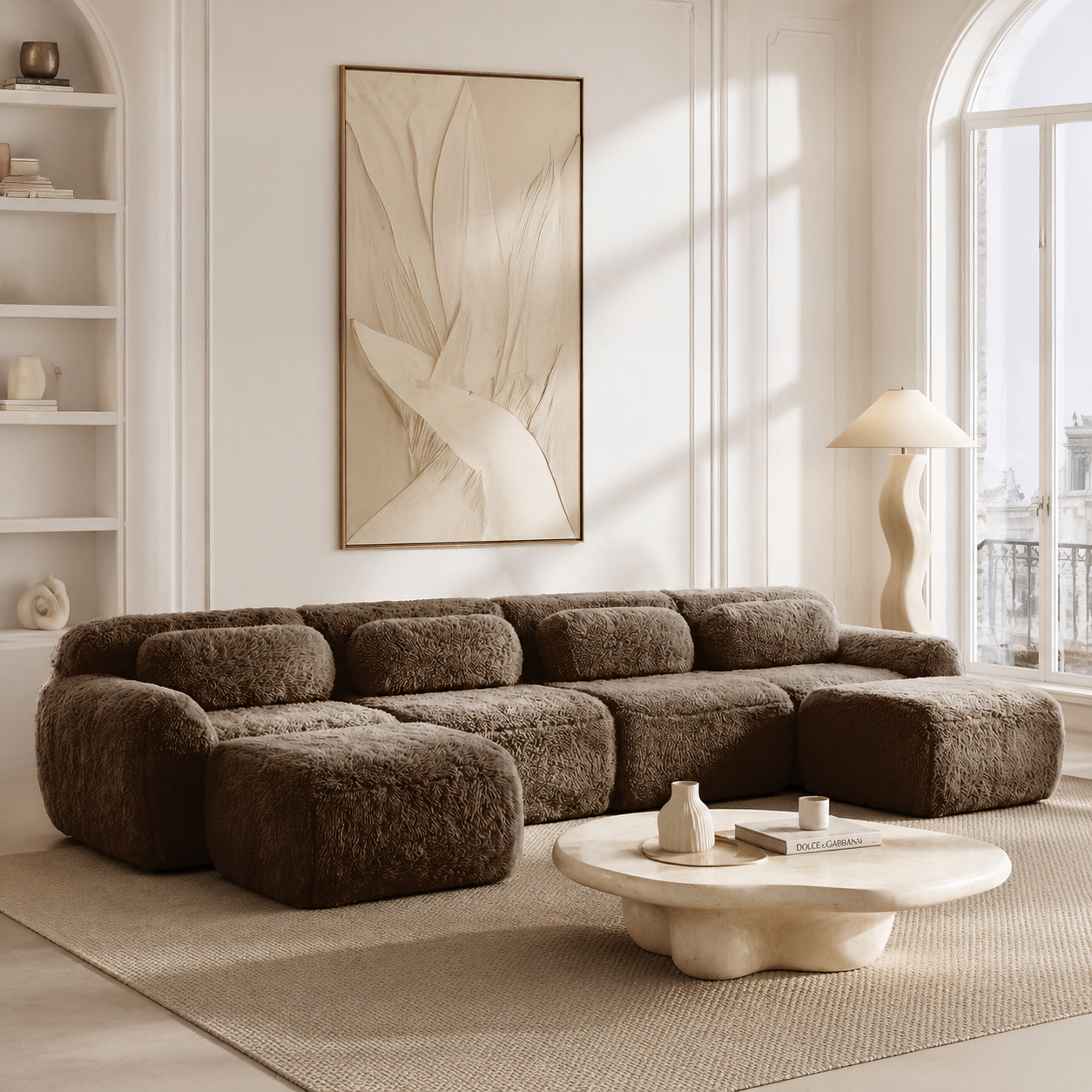 Durham brown plush U-shaped sectional sofa featured in a bright minimalist lounge with sculptural decor