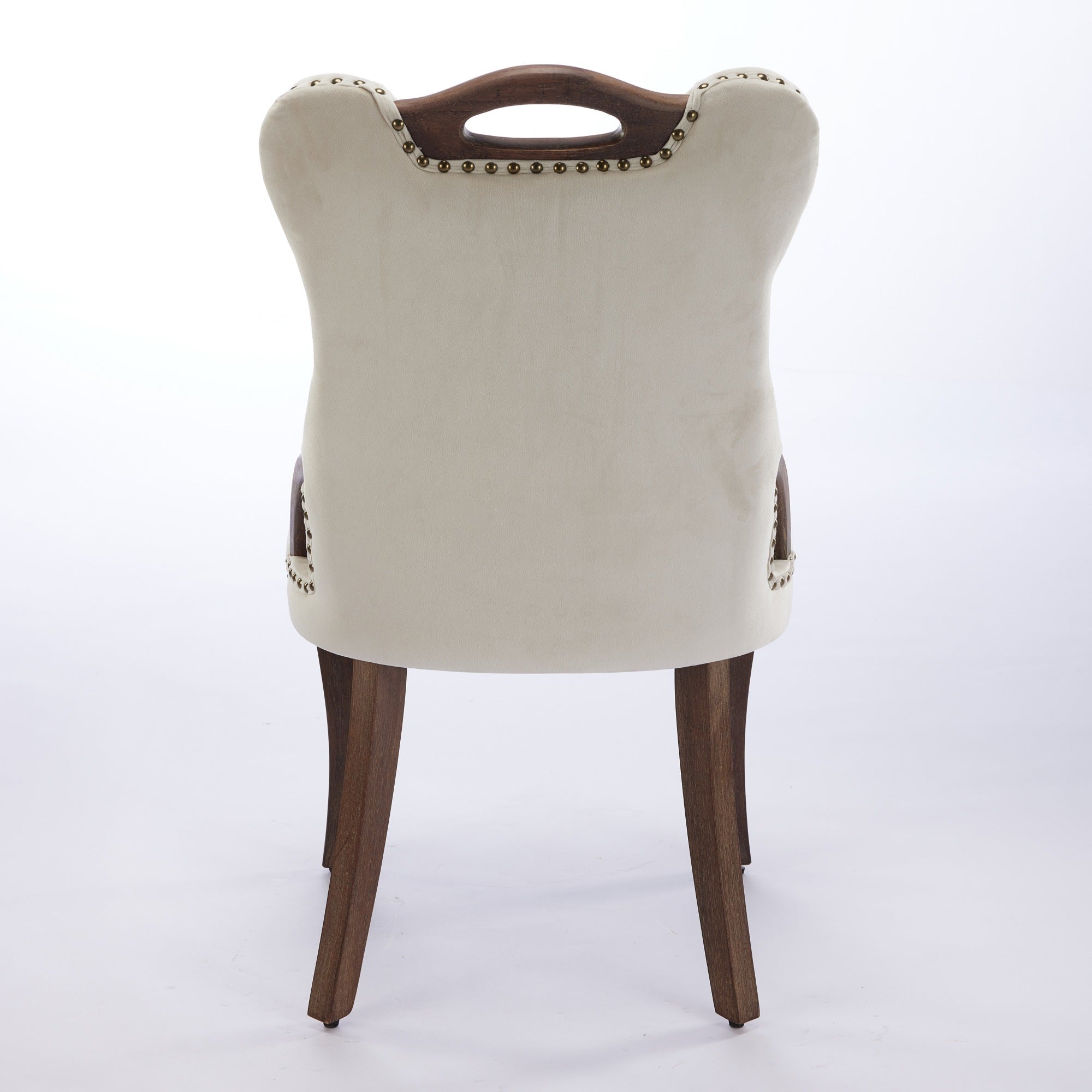 Elbe beige dining chair showing the full rear view with curved upholstery and wood top handle