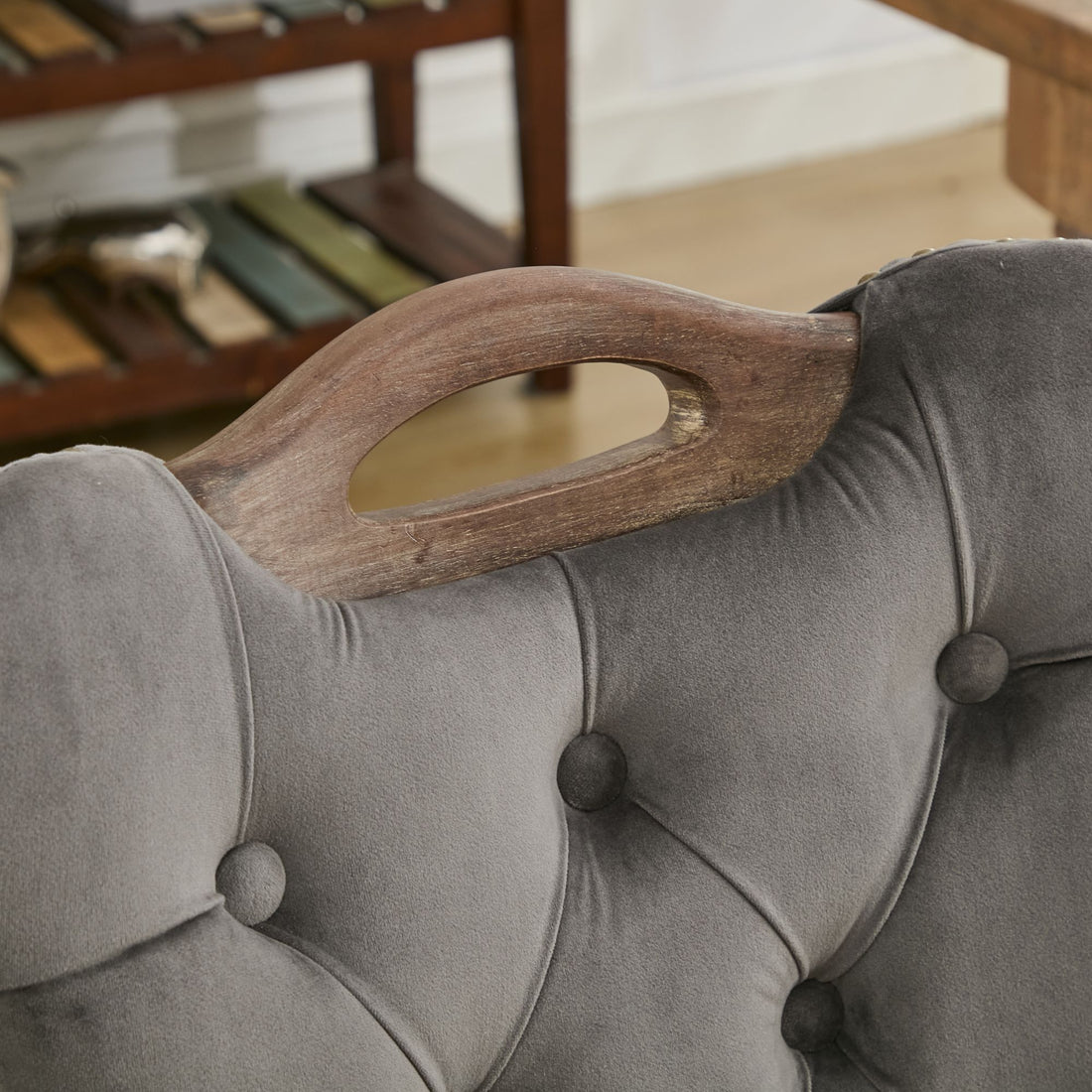 Elbe gray dining chair showing wood top handle and tufted backrest detail