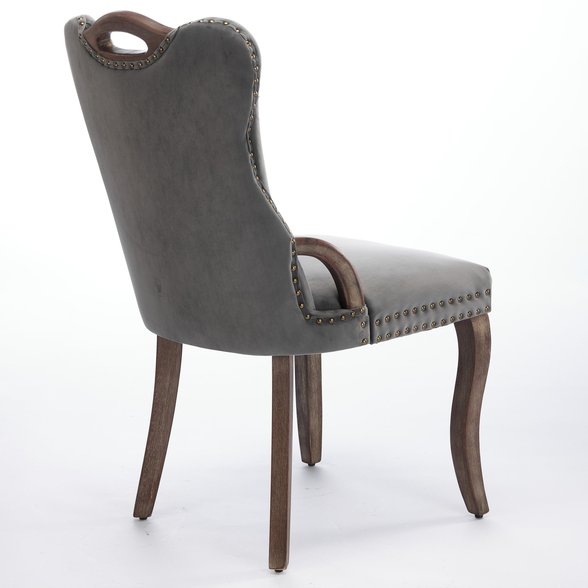 Elbe gray dining chair showing a rear angled view with curved back and wood top handle