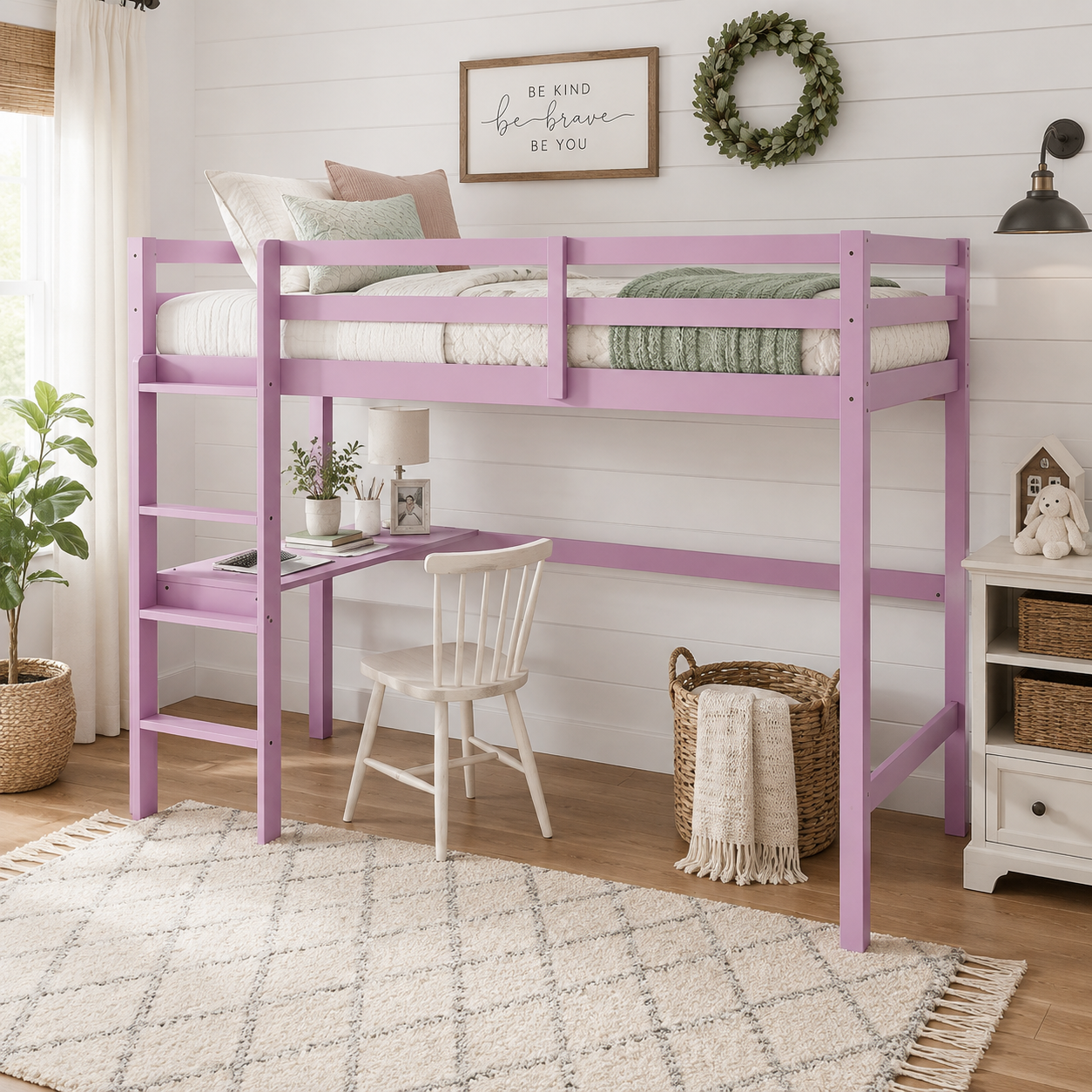 Elden pink loft bed showing a study workspace beneath the raised bed with desk and chair
