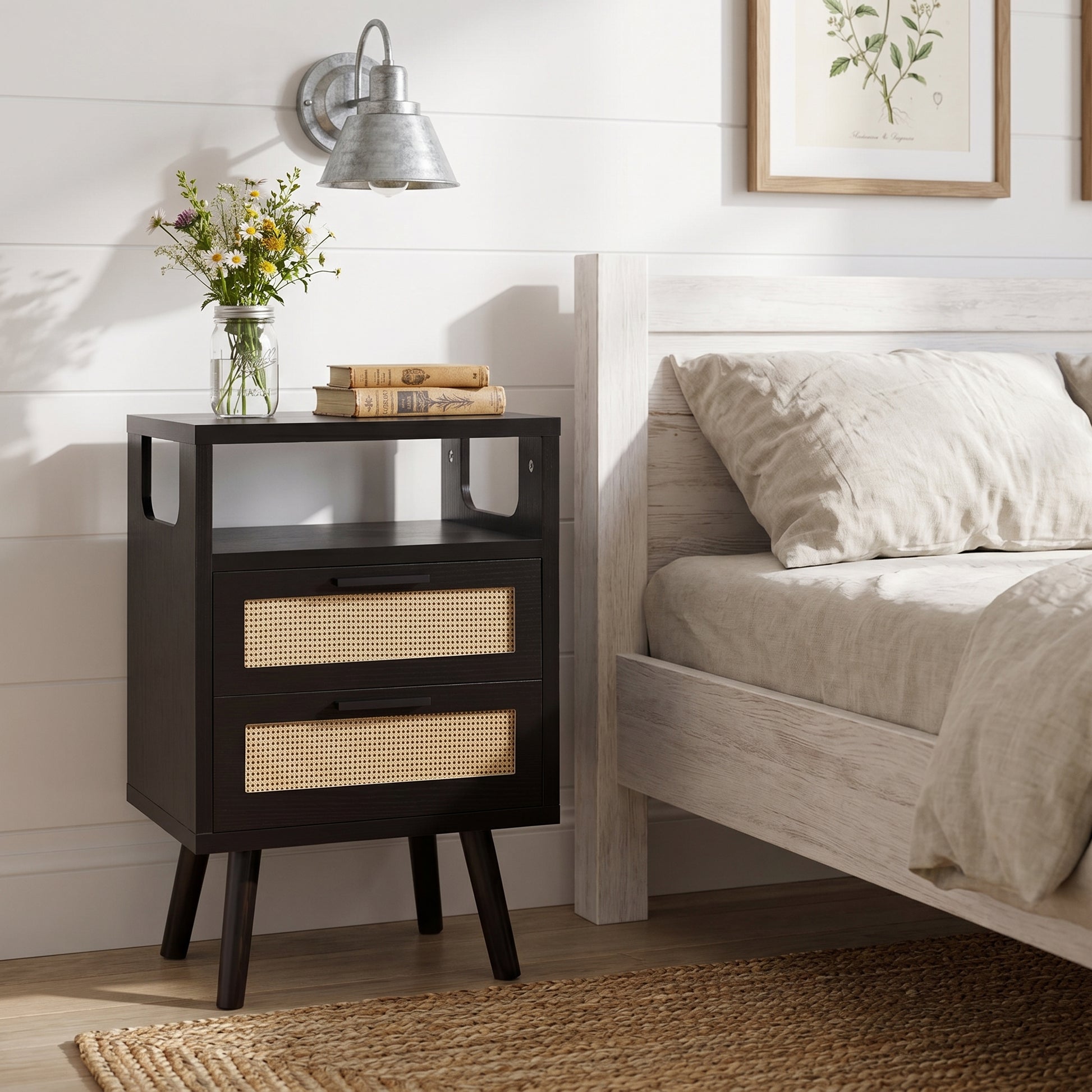 Elowen black nightstand styled beside bed in modern living room