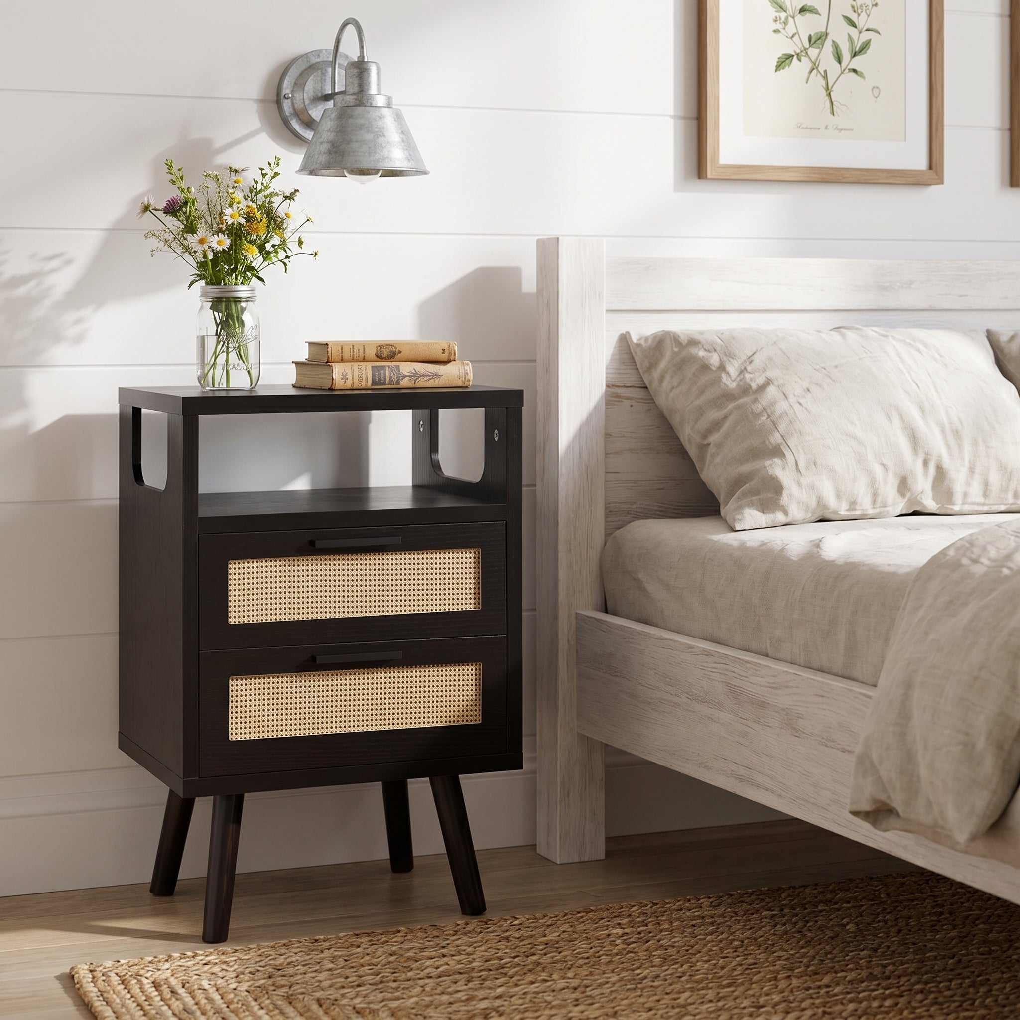 Elowen black nightstand styled beside bed in modern living room