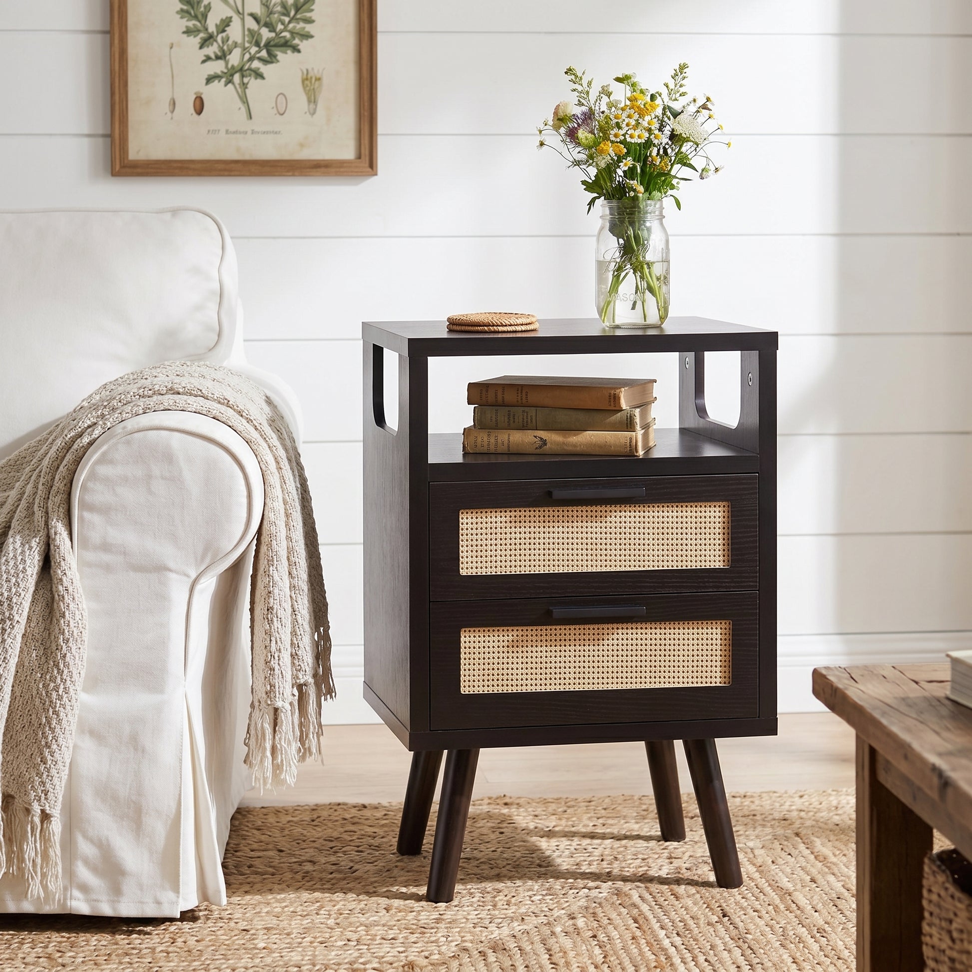 Elowen black nightstand in bright living room with decorative tabletop styling