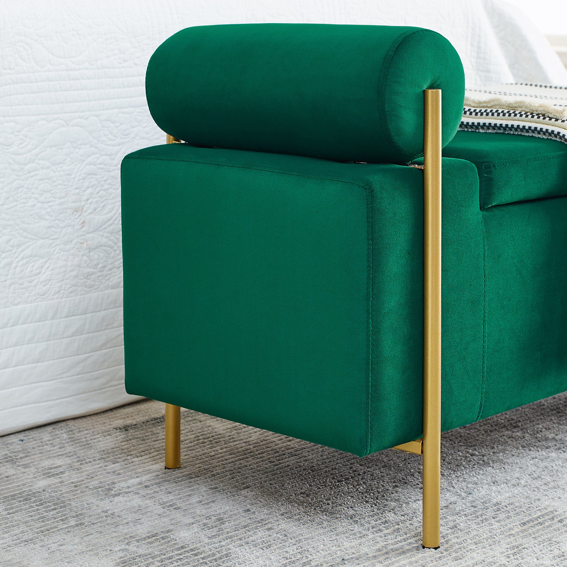 Everest green storage bench showing velvet upholstery and bolster arm side detail