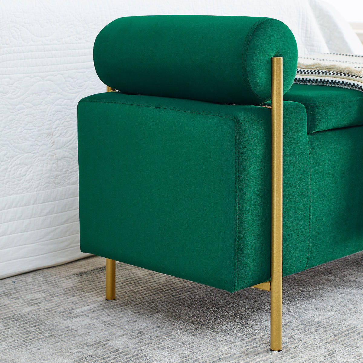 Everest green storage bench showing velvet upholstery and bolster arm side detail
