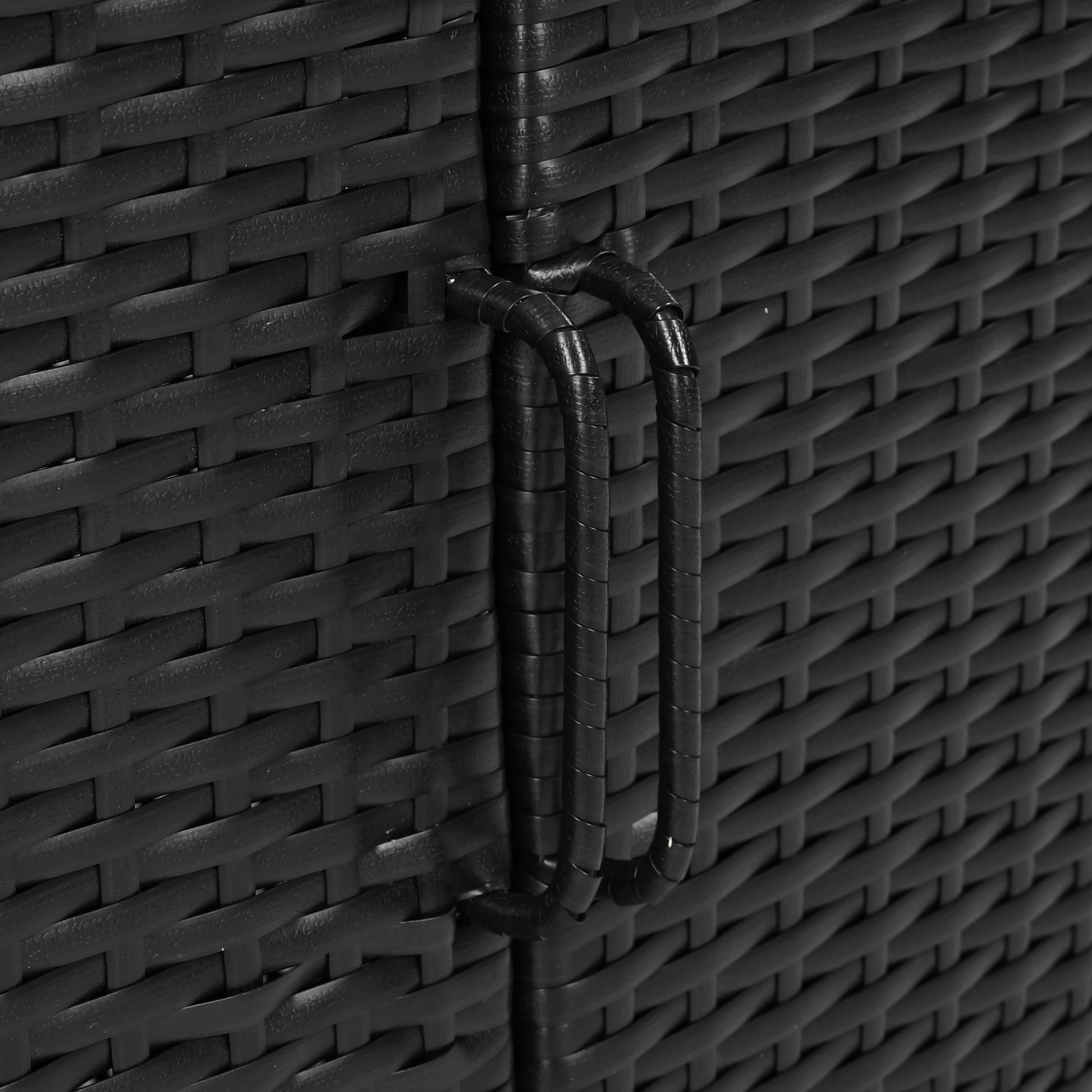 Ferrara black storage cabinet showing integrated wicker door handle and woven texture detail