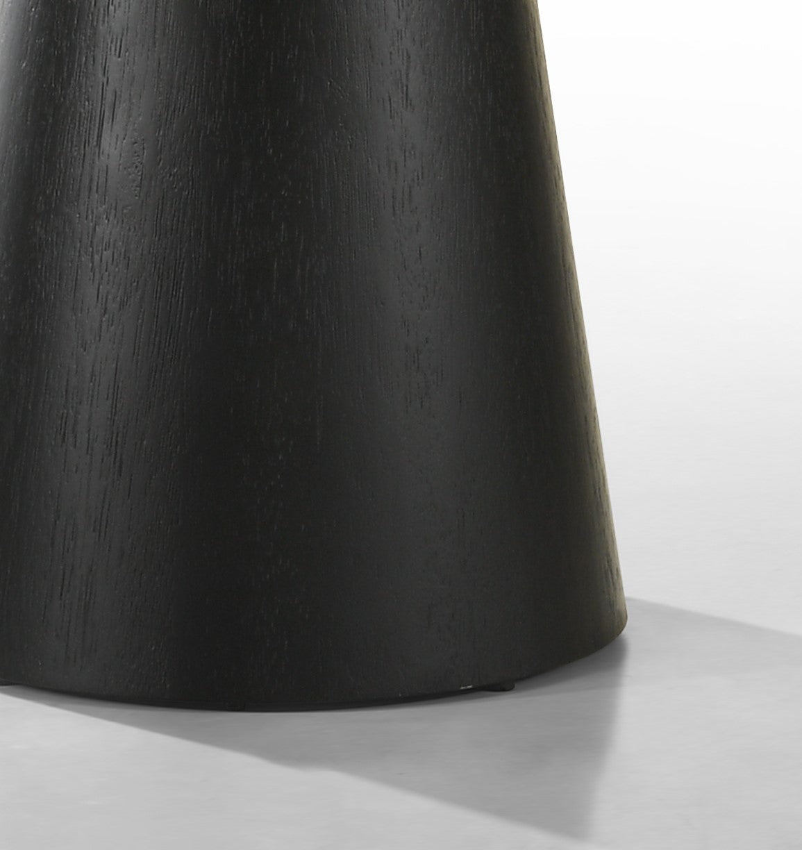 Genoa black coffee table close-up of the tapered pedestal base