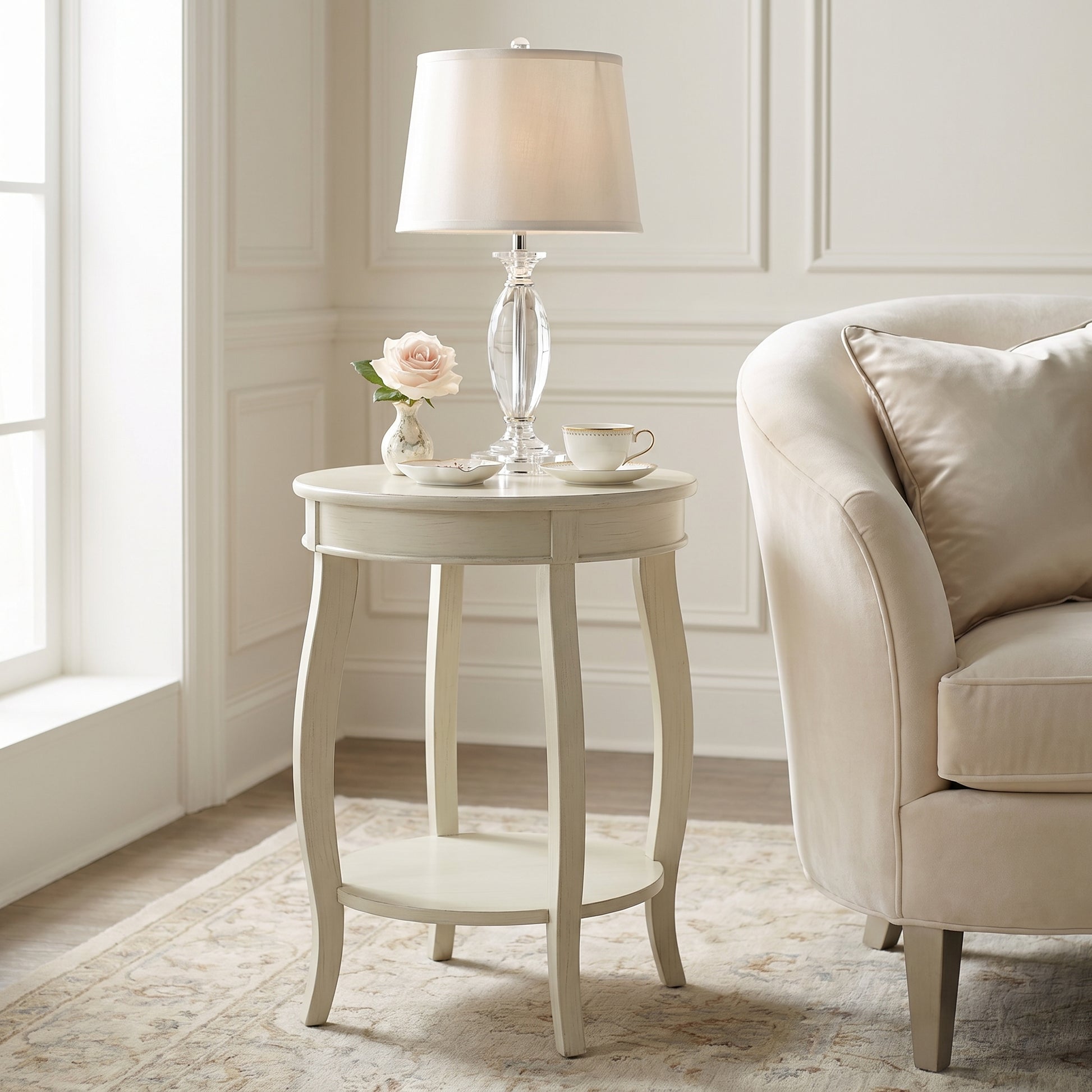 Gila white side table showing a round accent table beside a sofa in a bright living room
