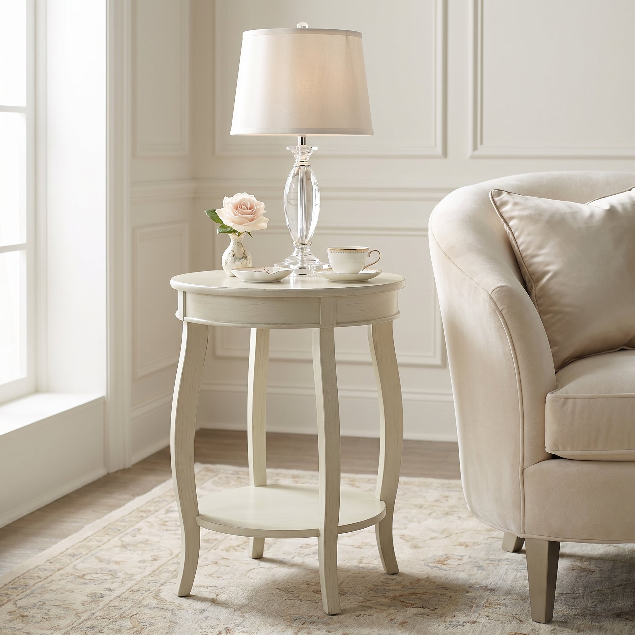 Gila white side table showing a round accent table beside a sofa in a bright living room