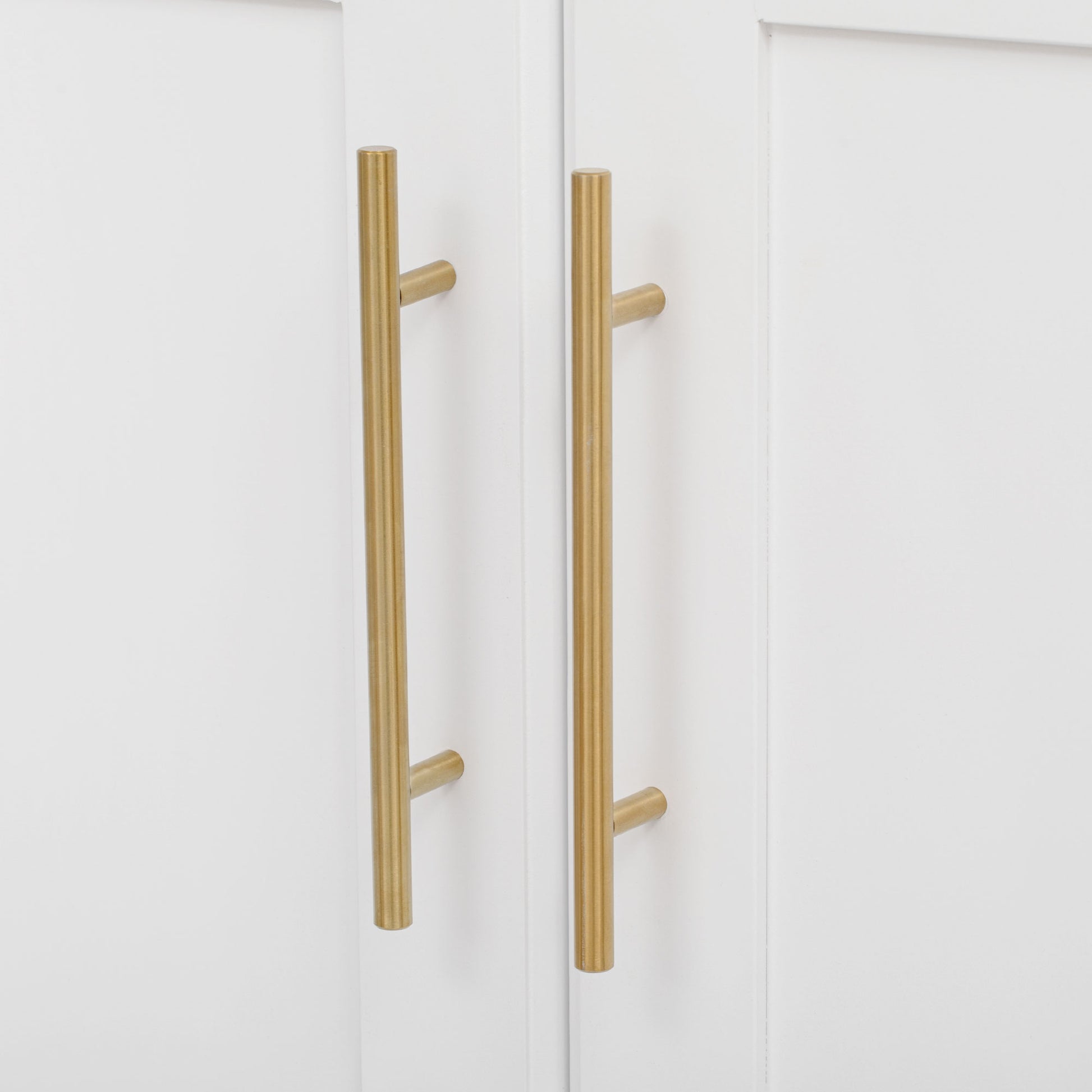 Honfleur rolling kitchen island gold cabinet door handles close-up in white finish on white background