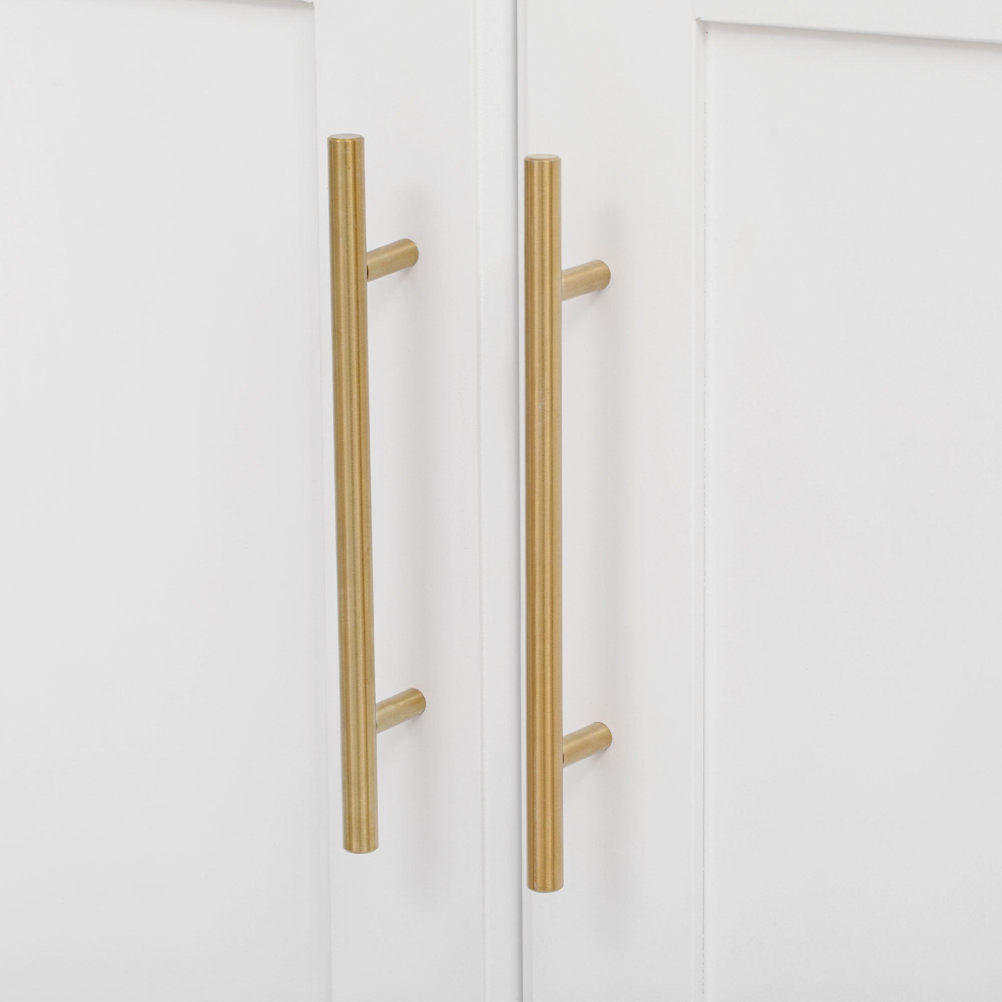 Honfleur rolling kitchen island gold cabinet door handles close-up in white finish on white background