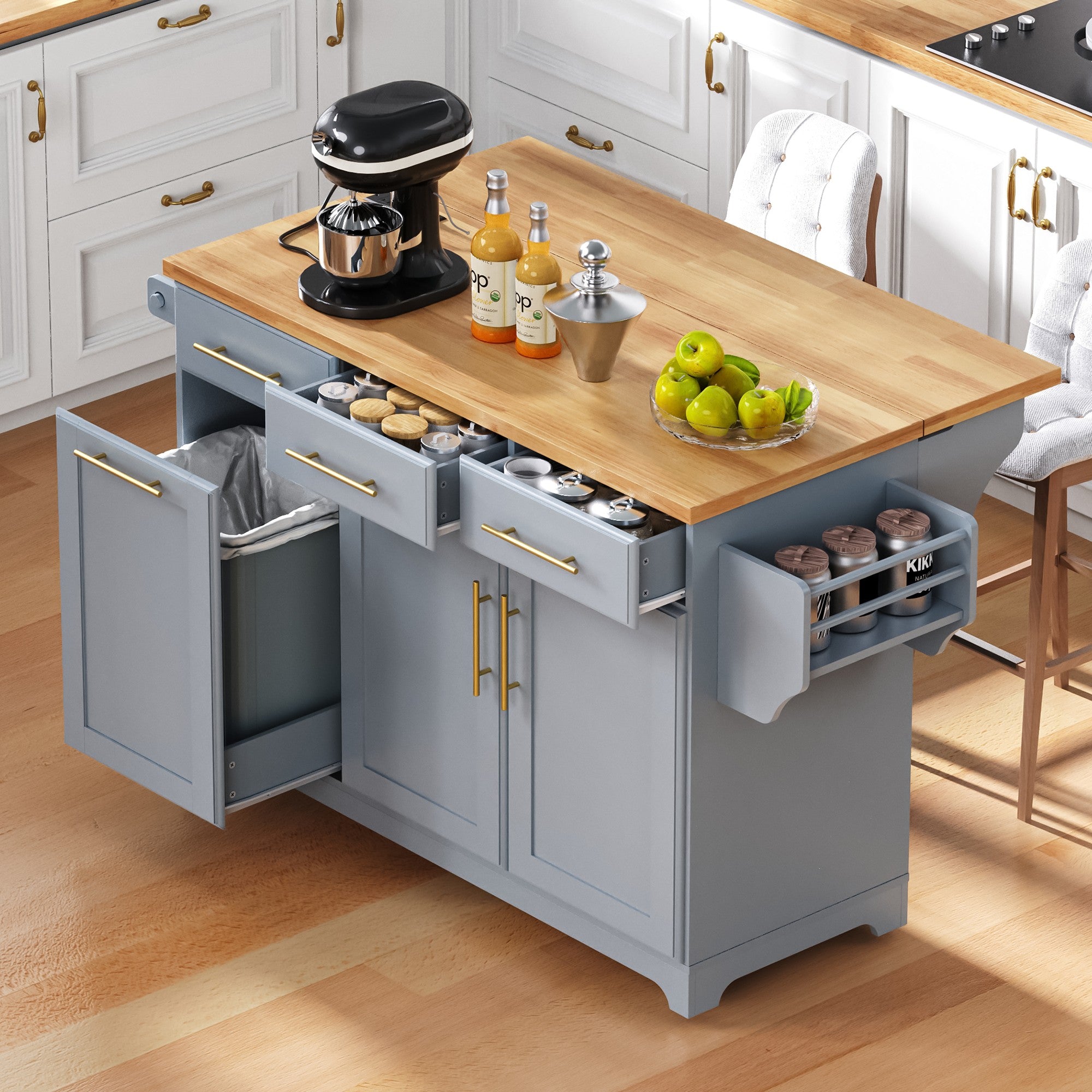 Honfleur gray rolling kitchen island with open spice drawers hidden trash cabinet and expandable rubberwood countertop in kitchen setting