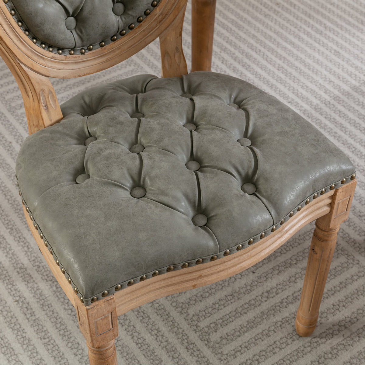 Iseo dark brown dining chair close-up of the button tufted seat cushion
