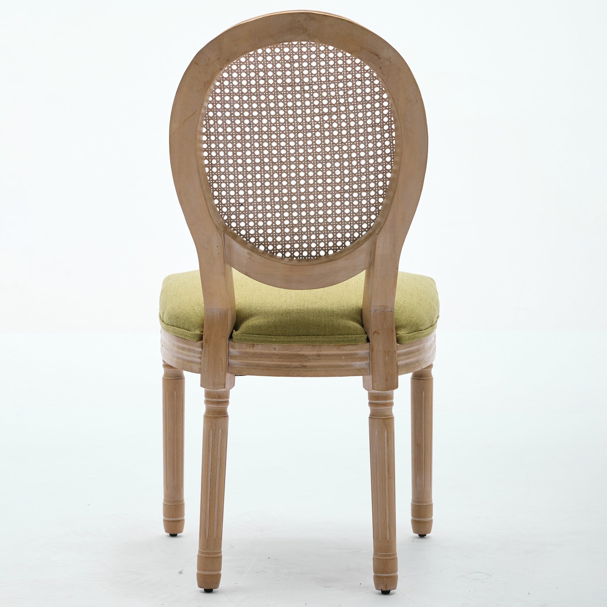 Iseo green dining chair rear view with oval cane backrest on white background