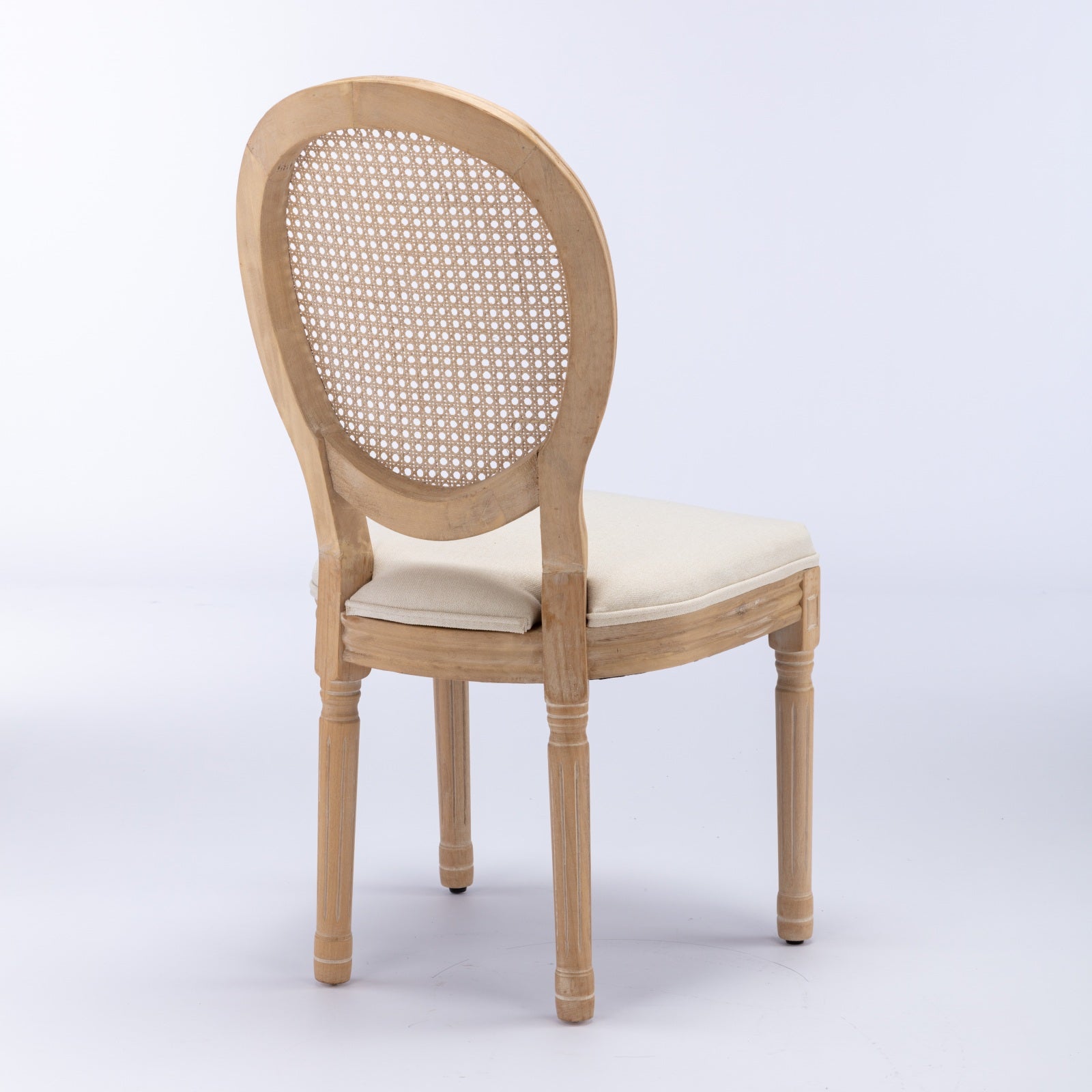 Iseo white dining chair rear angled view with cane backrest on white background