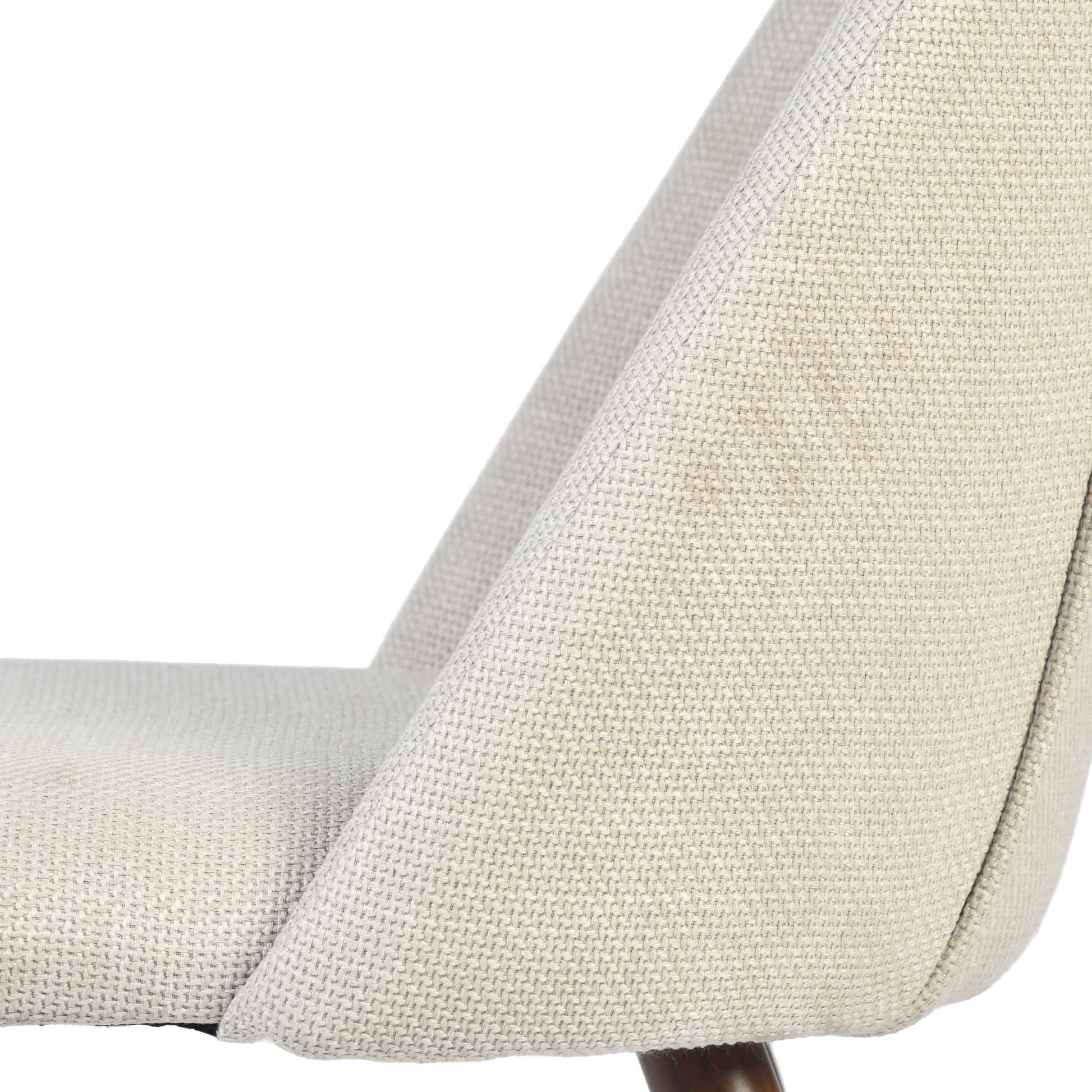 Kali beige upholstered dining chair showing side profile and upholstery detail