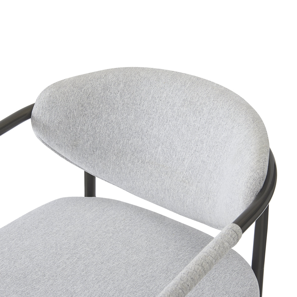 Kariba gray dining chair close-up of the upholstered seat and curved backrest edge