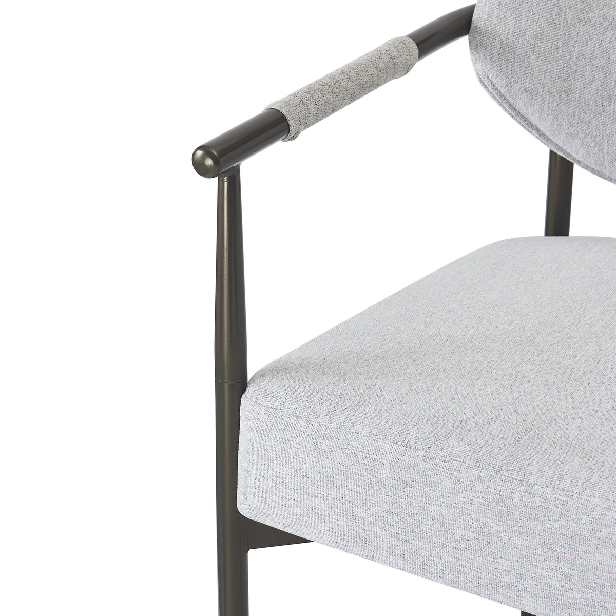 Kariba gray dining chair close-up of the metal arm support and upholstered seat