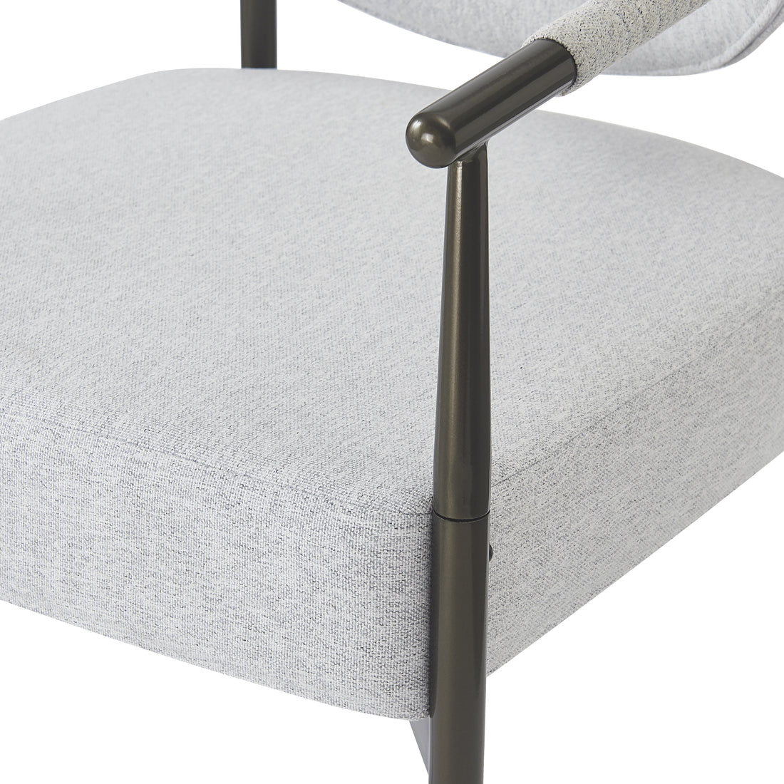 Kariba gray dining chair close-up of the slim metal frame beside the padded seat