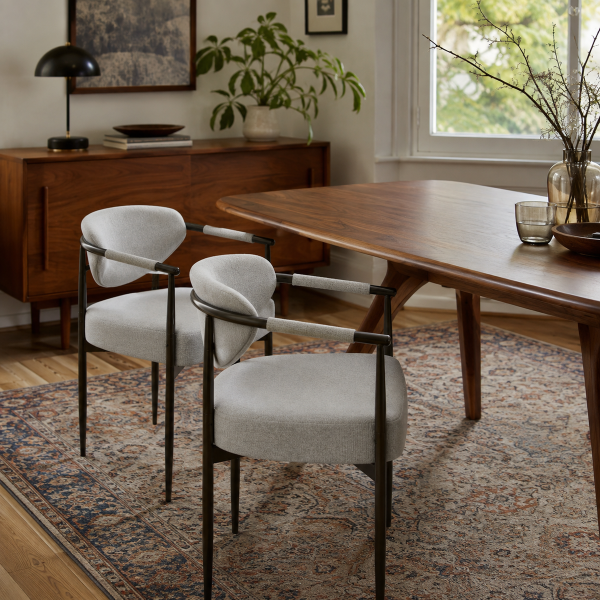Kariba gray dining chairs with slim metal frames around a wood table in a cozy dining room