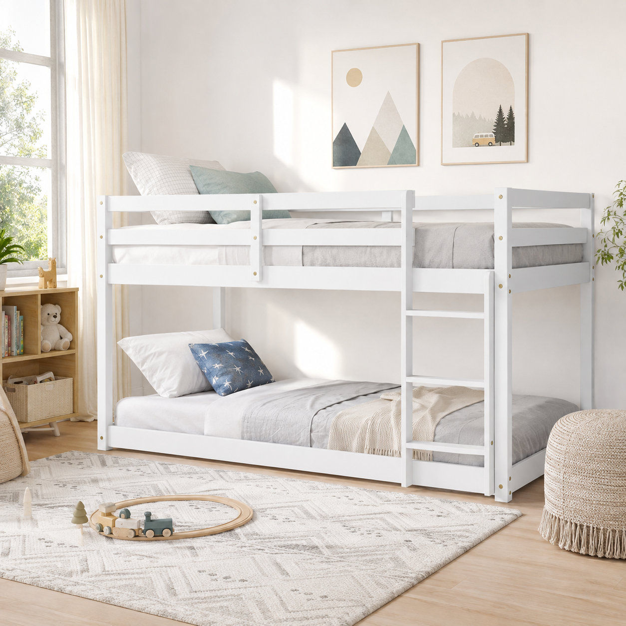 Korlis white twin over twin floor bunk bed in a light-filled bedroom with a rug and wall art